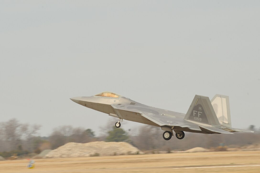 An F-22A Raptor takes off from a runway at Langley Air Force Base, Va,  Feb. 27, 2011.  Part of a two-day exercise, Langley Airmen from the 633rd Air Base Wing, 1st Fighter Wing and 192nd Fighter Wing worked together to practice deploying people, equipment and aircraft for contingency operations on short notice.  (U.S. Air Force photo by Staff Sgt. Logan Tuttle/Released)
