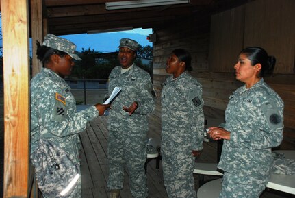 SOTO CANO AIR BASE, Honduras - Members of "The Gospel Ensemble" rehearse outside of the Oasis club, here, prior to the Black History Month dinner celebration at Joint Task Force-Bravo Feb. 25.  This year's theme focused on African-American individuals who made outstanding contributions during the American Civil War.  (Air Force photo/Captain John T. Stamm)