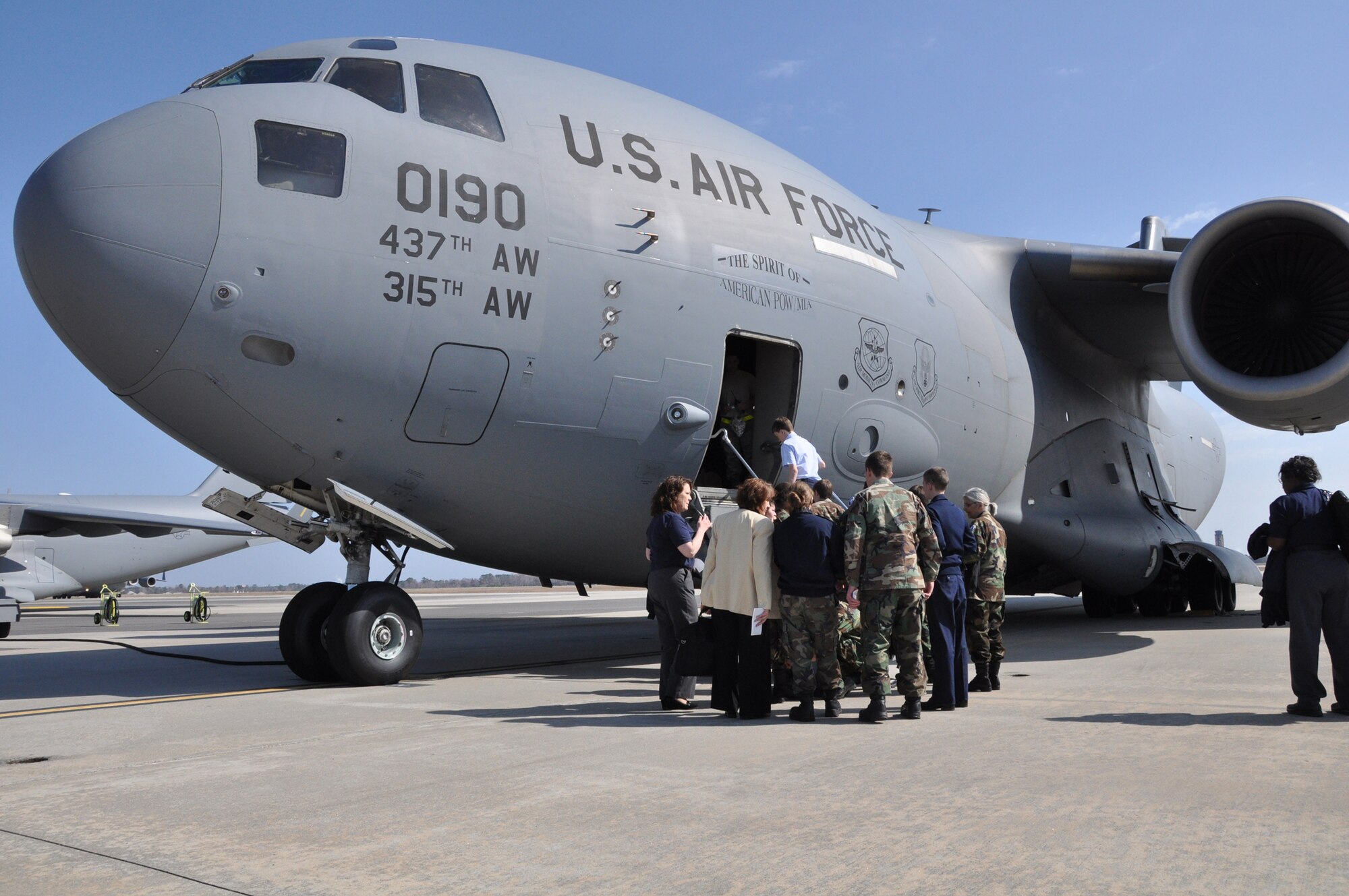 Cadets and leadership from the South Carolina Civil Air Patrol check their bags in front of a C17 Globemaster III aricraft at Joint Base Charleston, S.C. prior to boarding for an orientation flight with the 315th Airlift Wing here Feb. 26, 2011. (U.S. Air Force Photo/Senior Airman Robert Pilch)