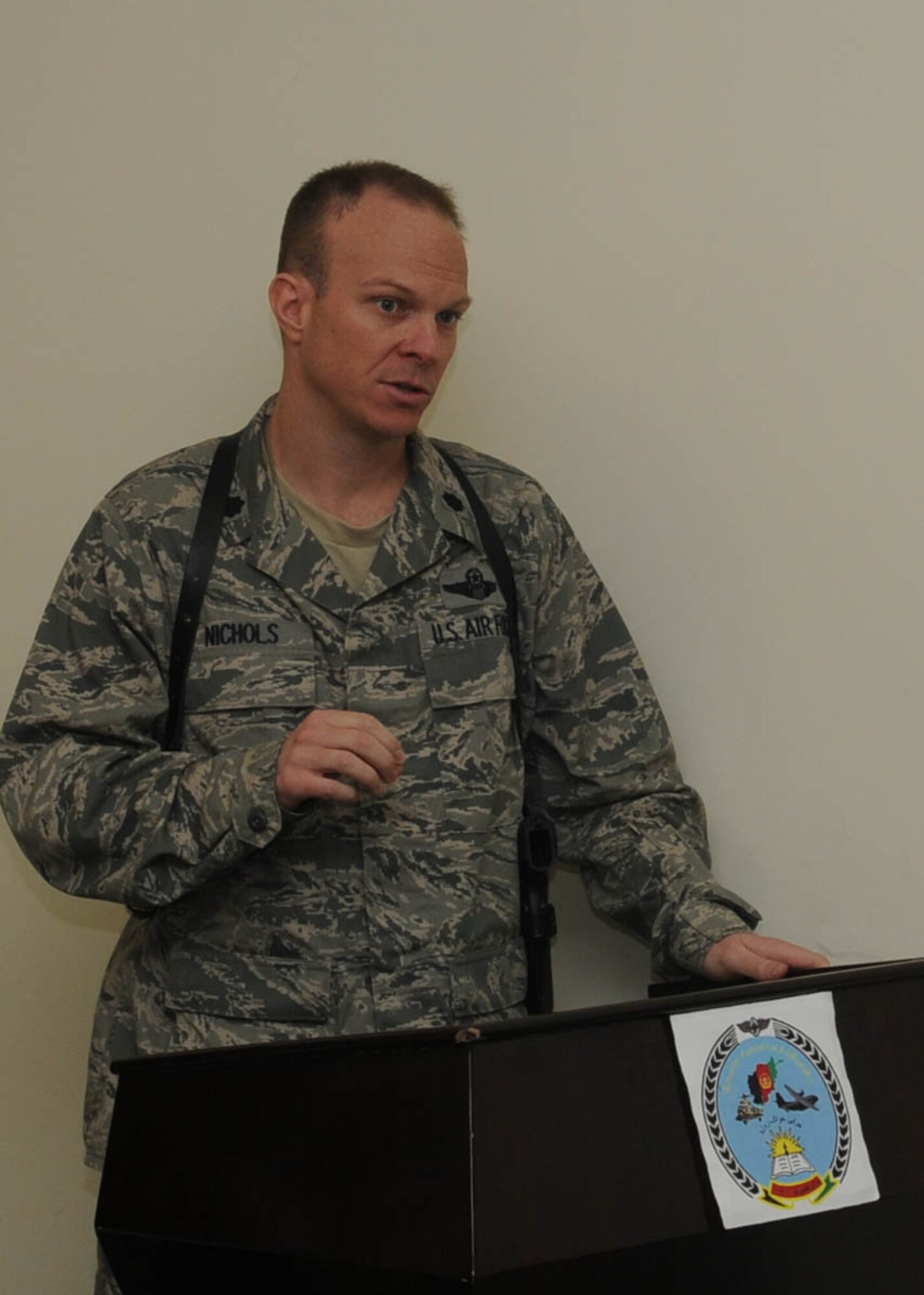 KABUL, Afghanistan - Lt. Col. Ryan Nichols, Commander of the 738th Air Expeditionary Advisory Squadron, speaks to members of the second graduating class of Afghan Air Force officer candidate school air orientation course at Pohantoon-e-Hawayee, the AAF's "Big Air School" in Kabul, Afghanistan Feb. 24. (U.S. Navy photo by Mass Communications 3rd Class Jared E. Walker)
