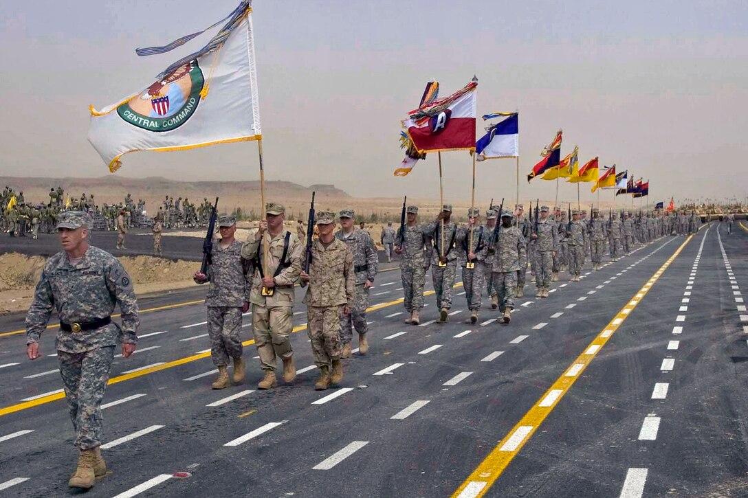 U.S. Army Brig. Gen. Robert McCaleb, assistant chief of staff, G8, Third Army, U.S. Army Central, leads troops during the 50/20 Celebration parade in Kuwait, Feb. 26, 2011. U.S. support for the celebration showcased the historical importance of the enduring relationship between the U.S. and Kuwait.
