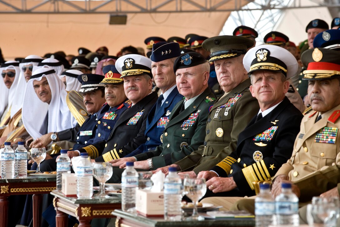 Left to Right; U.S. Navy Rear Adm. Mark Fox, commander of U.S. Naval Forces Central Command, Lt. Gen. Mike Hostage, commander of U.S. Air Forces Central Command, Lt. Gen. William G. Webster, commanding general, Third Army, U.S. Army Central, Gen. James Mattis, commander, U.S. Central Command, and Adm. Eric Olson, commander of the U.S. Special Operations Command, all view the proceedings at the 50/20 Celebration parade in Kuwait, Feb. 26, 2011. The 50/20 Celebration honors Kuwait’s 50-years of independence as well as 20 years since Kuwait’s liberation and Operation Desert Storm.