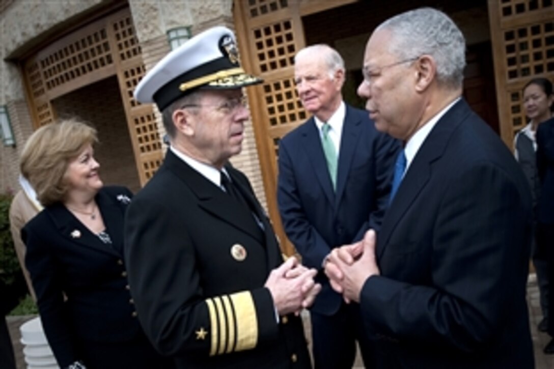 U.S. Ambassador to Kuwait Deborah K. Jones, left background, and U.S. Navy Adm. Mike Mullen, chairman of the Joint Chiefs of Staff, left foreground, talk with former U.S. Secretaries of State James Baker and retired U.S. Army Gen. Colin Powell, opposite Mullen, at the U.S. Embassy in Kuwait, Feb. 26, 2011. The four were in Kuwait to attend the 50th anniversary of the country’s independence. 