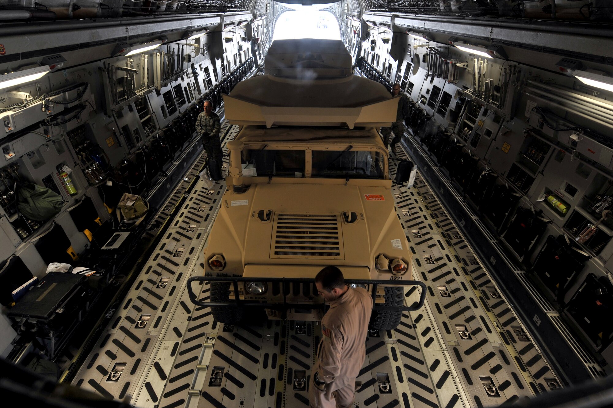 Members from the 455th Expeditionary Aerial Port Squadron unload cargo from a C-17 Globemaster III at Bagram Airfield, Afghanistan, Feb. 27, 2011.  The 455th EAPS was recently named the Air Combat Command’s winner of the 2011 Verne Orr Award. (Air Force photo by Senior Airman Sheila deVera)