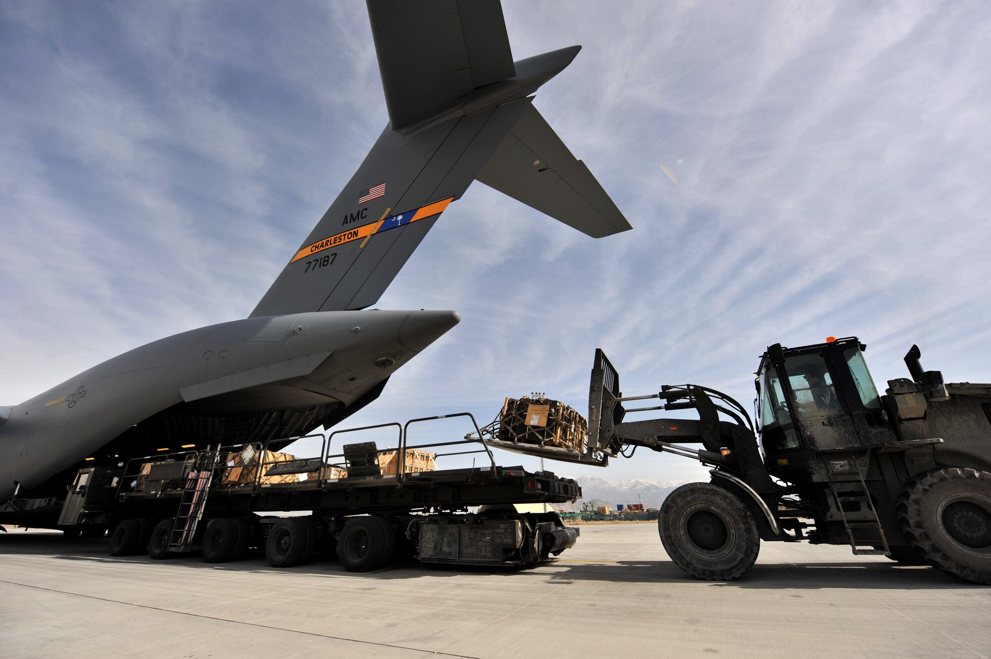 Members from the 455th Expeditionary Aerial Port Squadron unload cargo from a C-17 Globemaster III at Bagram Airfield, Afghanistan, Feb. 27, 2011.  The 455th EAPS was recently named the Air Combat Command’s winner of the 2011 Verne Orr Award. (Air Force photo by Senior Airman Sheila deVera)