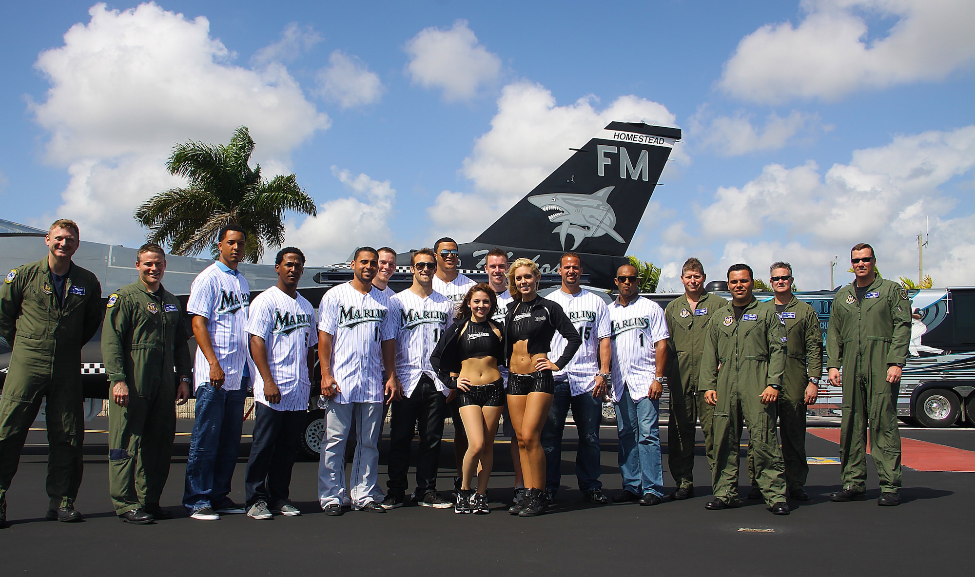 The Homestead Air Reserve Base hosted Major League players from the Florida Marlins on Thursday, Feb. 17 as part of the Marlins as the 2011 Caravan for the Troops. Airmen, players, and mermaids pose in front of a F-16 after getting a personal tour of the aircraft by the 93rd Makos pilots. (Photo by Senior Airman Lou Burton, Public Affairs)