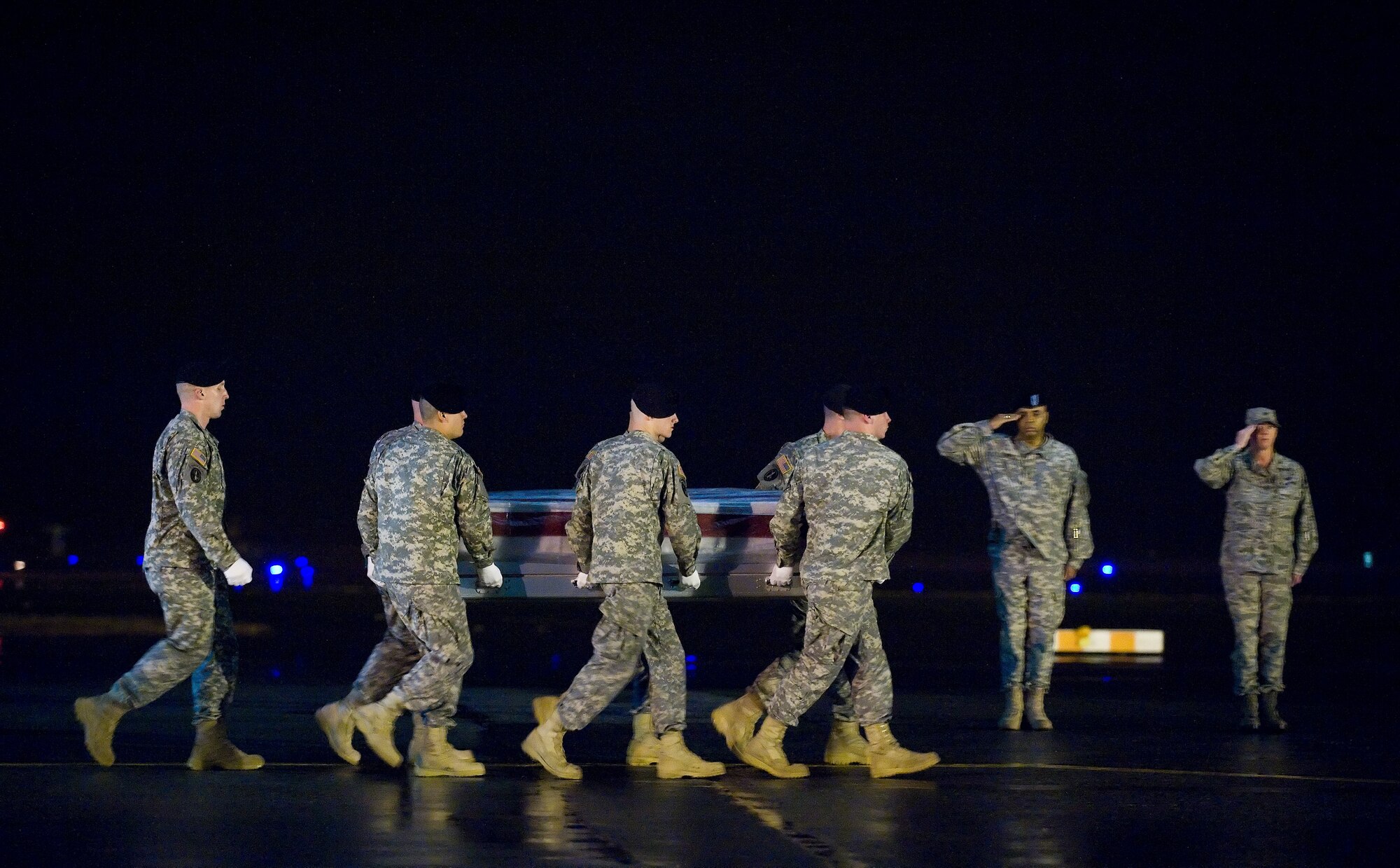 A U.S. Army carry team transfers the remains of Army Spc. Andrew C. Wilfahrt of Rosemount, Minn., at Dover Air Force Base, Del., Feb. 28, 2011.  Wilfahrt was assigned to the 504th Military Police Battalion, 8th Military Police Brigade, 8th Theater Sustainment Command, Schofield Barracks, Hawaii.  (U.S. Air Force photo/Jason Minto)