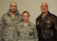Senior Airman Delania Moose, 919th Security Forces Squadron, poses for a photo with Chief Master Sgt. Michael Klausutis, 919th Special Operations WIng command chief, left, and Col. Andy Comtois, 919th SOW commander, after they informed her of her selection as the wing's 2010 Airman of the Year.  The senior leaders traveled to four different work centers to surprise the winners of the Airman, NCO, senior NCO and first sergeant categories. (U.S. Air Force photo/Tech. Sgt. Samuel King Jr.)