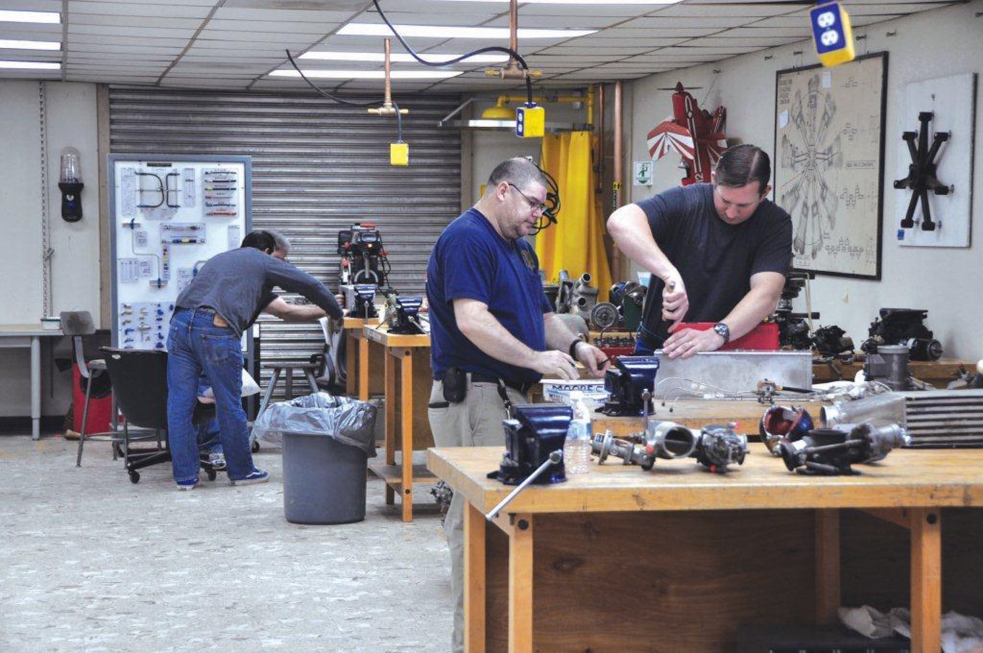 Students attending the School of Aviation Technology at the former George Air Force Base in Victorville, Calif., get hands-on training as aircraft mechanics. The school is one of various activities brought to the base through the efforts of Air Force Real Property Agency personnel. (U.S. Air Force photo/Scott Johnston)