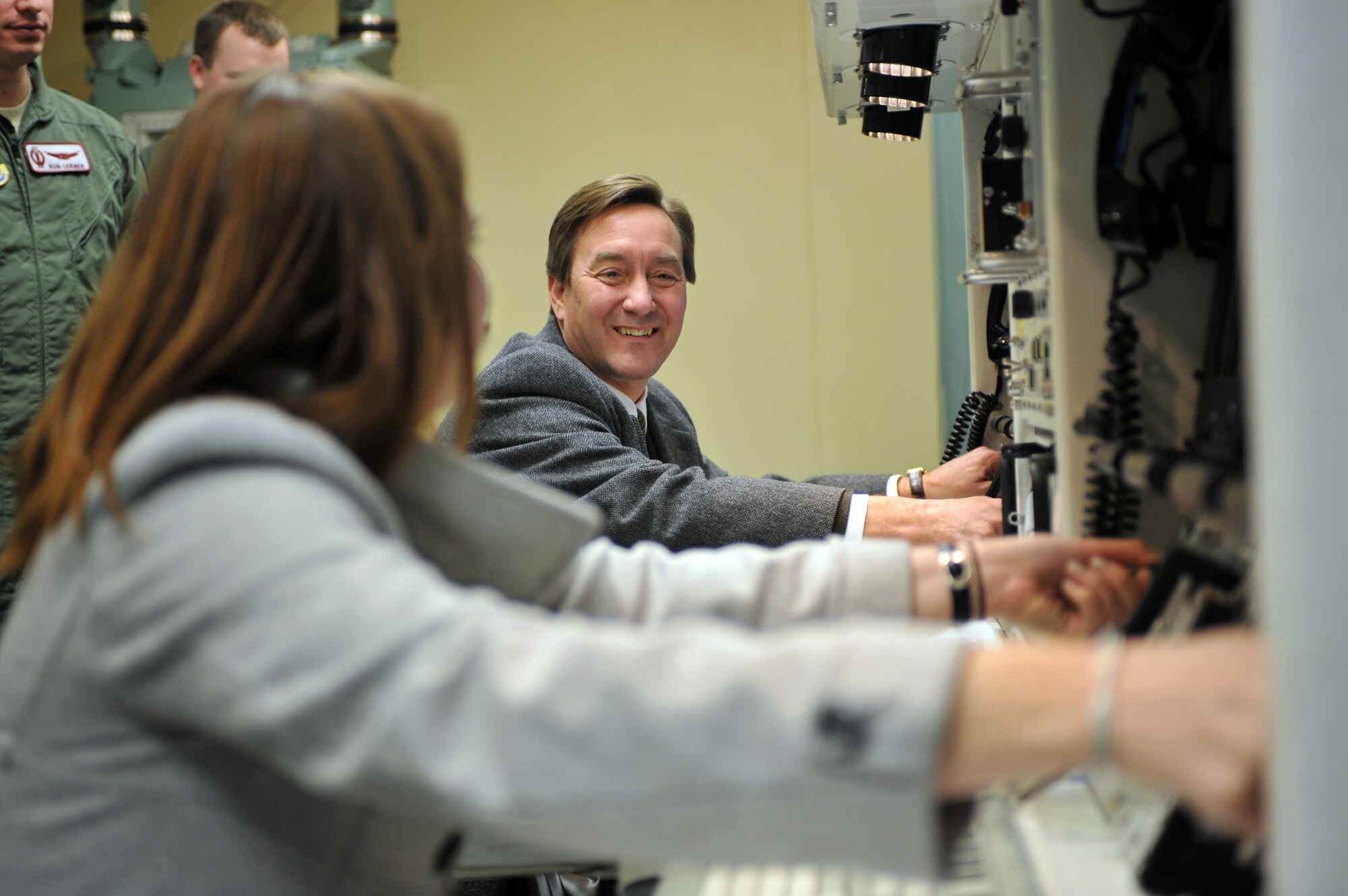 MINOT AIR FORCE BASE, N.D. -- North Dakota Congressman Rick Berg along with his Director of Communications Ms. Alee Lockman, “practice” their key turning technique inside the missile procedures trainer here Feb. 23. This trip marked the congressman’s first visit to Minot to familiarize himself with the base and its mission. (U.S. Air Force photo/Staff Sgt. Keith Ballard)