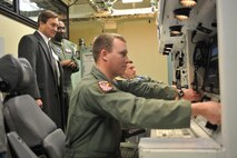 MINOT AIR FORCE BASE, N.D. -- North Dakota Congressman Rick Berg talks with Lt. Col. Kelvin Townsend, 91st Operations Support Squadron commander, about the life of a missileer inside a missile alert facility while Capt. Robert Lerner (pictured seated in background), 91st OSS intercontinental ballistic missile instructor, and 1st Lt. Lee Payne (pictured seated foreground), 91st OSS deputy intercontinental ballistic missile instructor, demonstrate a missile launch inside the missile procedures trainer here Feb. 23. This trip marked the congressman’s first visit to Minot to familiarize himself with the base and its mission. (U.S. Air Force photo/Staff Sgt. Keith Ballard) 