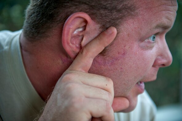 VALDOSTA, Ga. -- Master Sgt. Robert Disney, 347th Rescue Group standards and evaluations superintendent, reenacts a firefight in which he received a gunshot wound to the face while deployed Feb. 24 at his home. Sergeant Disney received a Purple Heart on May 1, 2003, for his actions during the incident. (U.S. Air Force photo/Staff Sgt. Jamal D. Sutter)(RELEASED)