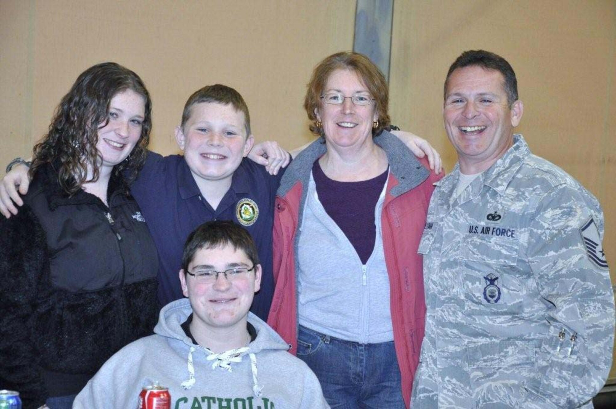 FALMOUTH, Mass. - Colleen, Ryan, Kevin and Theresa Sullivan welcomed home Master Sgt. Kevin Sullivan, of the 102nd Security Forces Squadron, at a ceremony Tuesday, Feb. 22, 2011. The 102nd Intelligence Wing of the Massachusetts Air National Guard honored 42 airmen from the 102nd Security Forces Squadron (SFS) upon their return home from their deployment to Iraq.
The wing held a welcome home ceremony to honor them and their families on Tuesday, Feb. 22, 2011. The Airmen have received mobilization orders last year and were deployed to Iraq for six-months in support of Operation New Dawn. Their primary responsibilities were to provide security and air base defense operations. This was the largest number of 102nd SFS Airmen to deploy at the same time since Sept. 11, 2001. (U.S. Air Force Photo by Maj. Lisa Ahaesy, Massachusetts National Guard)