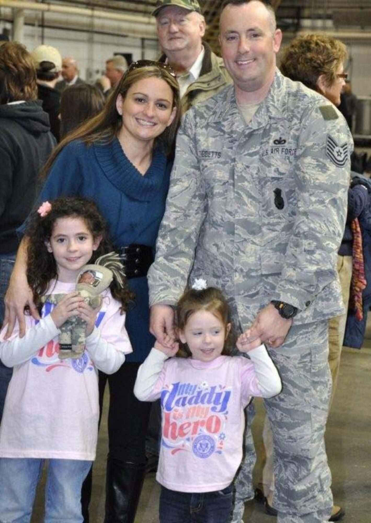 FALMOUTH, Mass. - Tech. Sgt. Stephen Tibbetts, his wife, Jennifer, and daughters, Gemma and Sophia, were honored at a welcome home ceremony on Tuesday, Feb. 22, 2011. The 102nd Intelligence Wing of the Massachusetts Air National Guard honored 42 airmen from the 102nd Security Forces Squadron upon their return home from their deployment to Iraq. Tibbetts received mobilization orders last year and was deployed to Iraq for six-months in support of Operation New Dawn. Their primary responsibilities were to provide security and air base defense operations. This was the largest number of 102nd SFS Airmen to deploy at the same time since Sept. 11, 2001. (U.S. Air Force Photo by Maj. Lisa Ahaesy, Massachusetts National Guard)