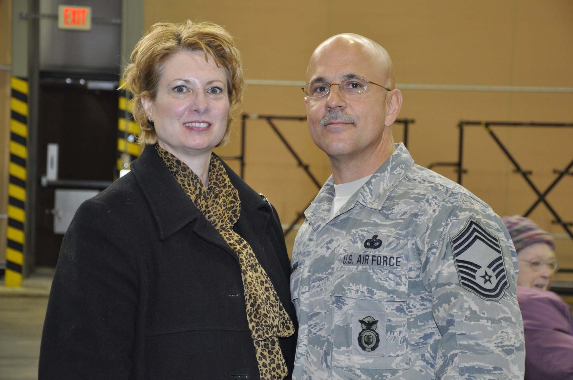 FALMOUTH, Mass. - Chief Master Sgt. Wayne Raymondo, and his wife, Leigh, were honored at a welcome home ceremony on Tuesday, Feb. 22, 2011. The 102nd Intelligence Wing of the Massachusetts Air National Guard honored 42 airmen from the 102nd Security Forces Squadron upon their return home from their deployment to Iraq. Raymondo, Superintendent of the 102nd SFS, received mobilization orders last August and was deployed to Iraq for six-months in support of Operation New Dawn. Their primary responsibilities were to provide security and air base defense operations. This was the largest number of 102nd SFS Airmen to deploy at the same time since Sept. 11, 2001. (U.S. Air Force Photo by Maj. Lisa Ahaesy, Massachusetts National Guard)
