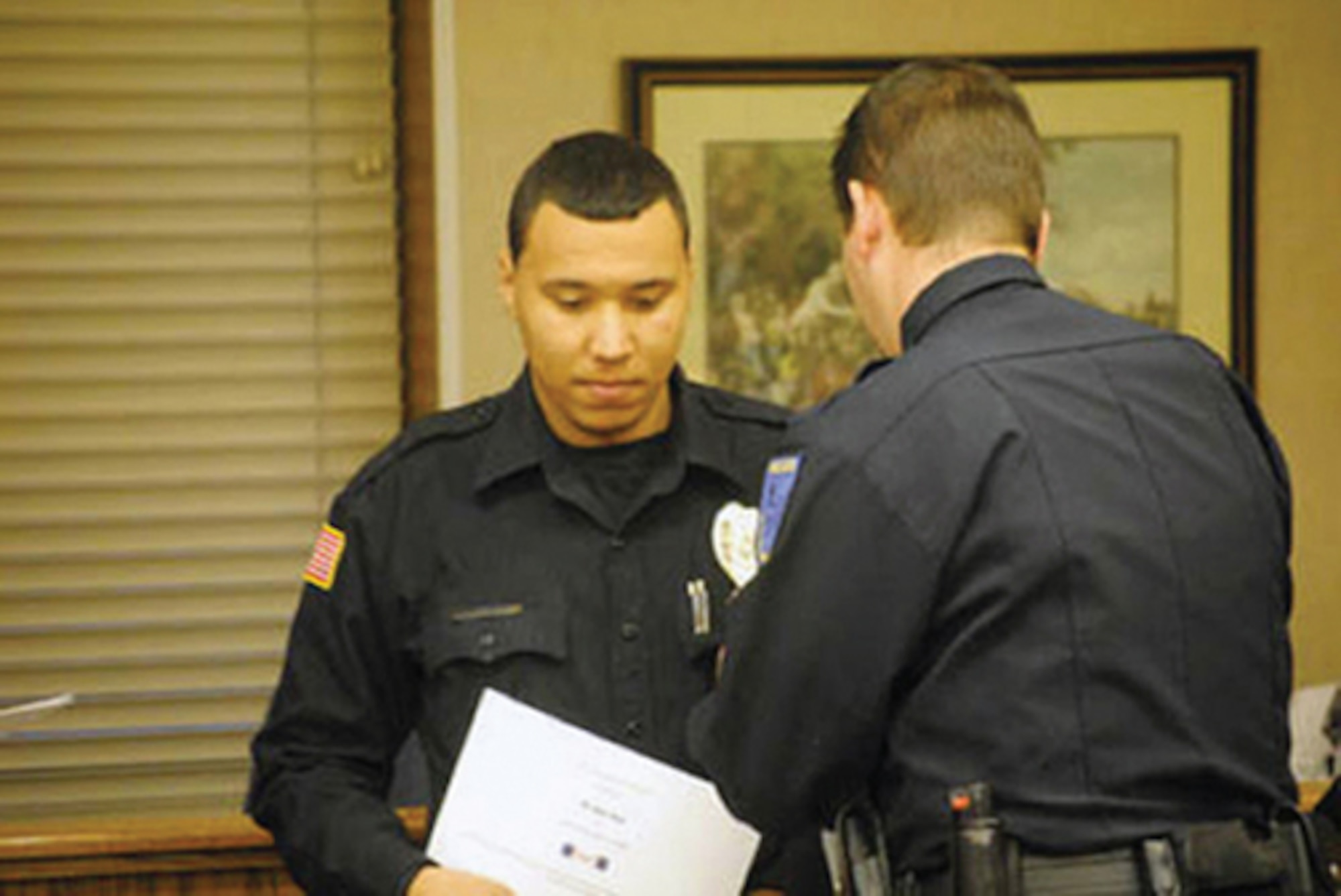 Officer (Senior Airman) Ryan Stark is awarded by Marshall, Mo. Police Department and the City Council for heroic actions while he was on duty as a Marshall police officer. Airman Stark is an aircrew flight equipment technician with the 442nd Operation Group, part of the 442nd Fighter Wing, an A-10 Thunderbolt II Air Force Reserve unit at Whiteman Air Force Base, Mo. (Photo by Sarah Reed/Democrat News, permission for use granted)