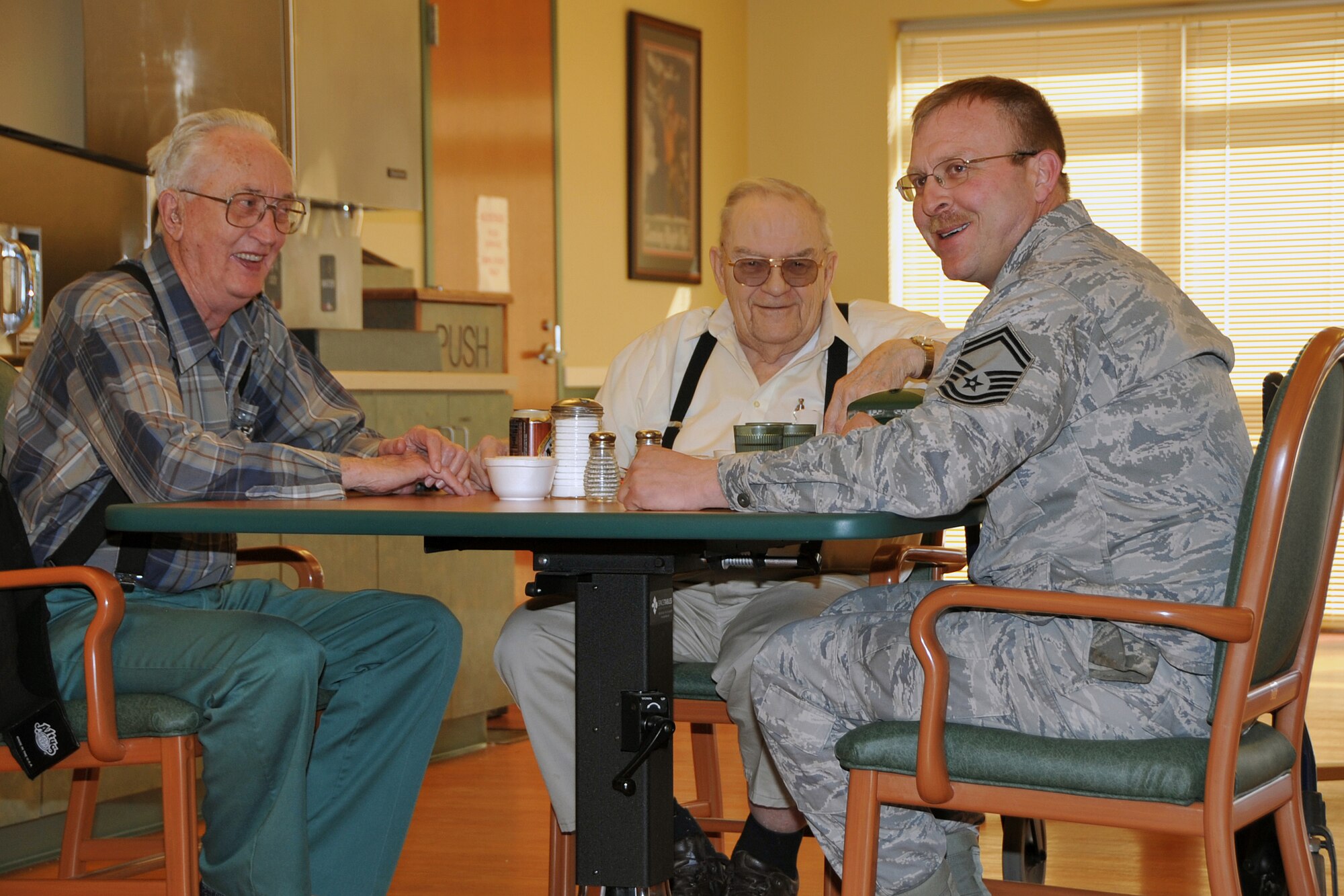 OFFUTT AIR FORCE BASE, Neb. ? Senior Master Sgt. Tadd Goehring, 55th Aircraft Maintenance Squadron, enjoys a chat with local residents of the Eastern Nebraska Veterans Home, Feb. 16. Members of the Air Force Sergeant's Association, Chapter 984 make frequent visits to the home in Bellevue. U.S. Air Force Photo by Jeff W. Gates