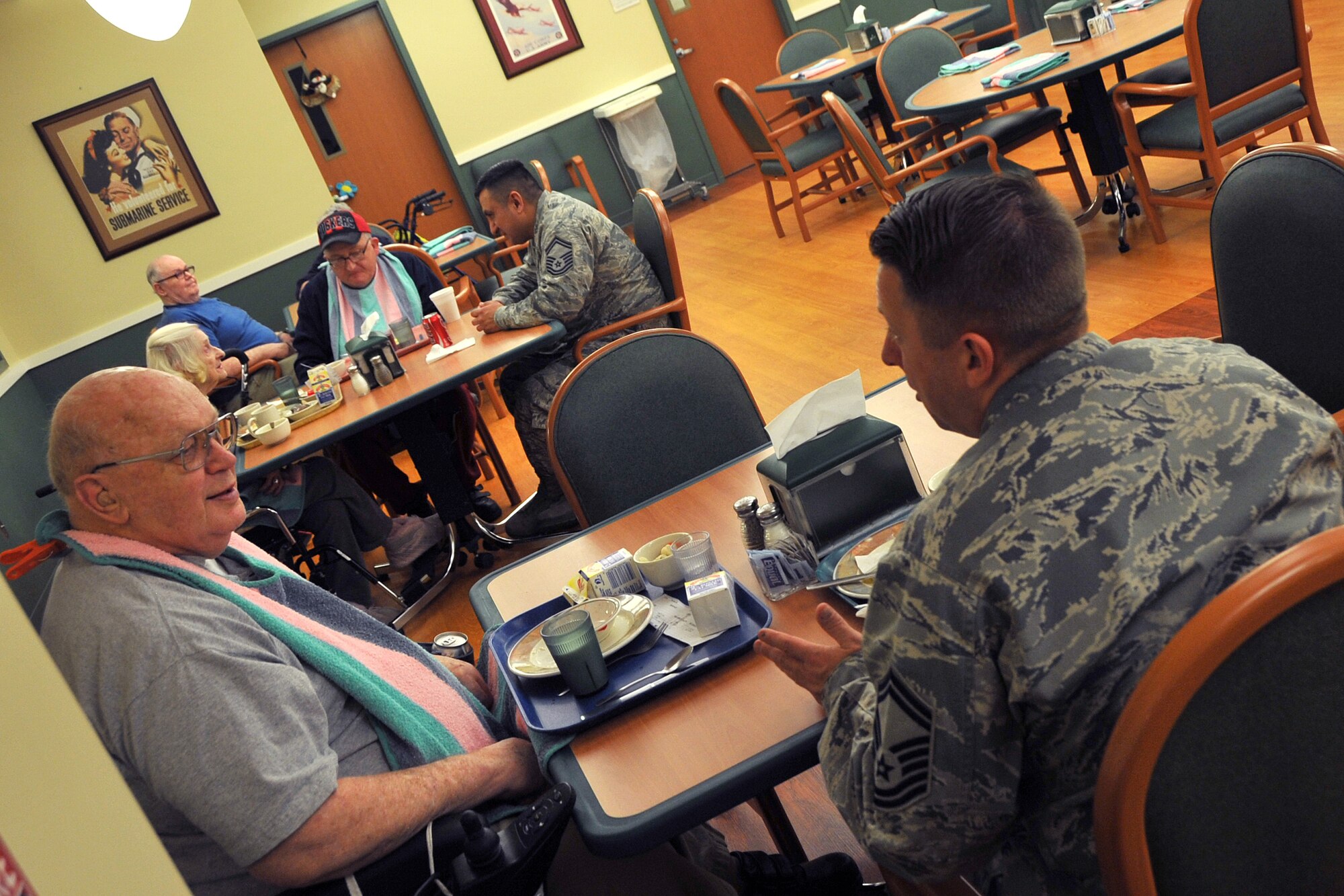 OFFUTT AIR FORCE BASE, Neb. ? Senior Master Sgt. Matthew Becker (bottom right), 55th Maintenance Squadron, and Senior Master Sgt. Juann Montez (top right) from the 55th Aircraft Maintenance Squadron, enjoy a chat with local residents of the Eastern Nebraska Veterans Home, Feb. 16. Members of the Air Force Sergeant's Association, Chapter 984 make frequent visits to the home in Bellevue. U.S. Air Force Photo by Jeff W. Gates