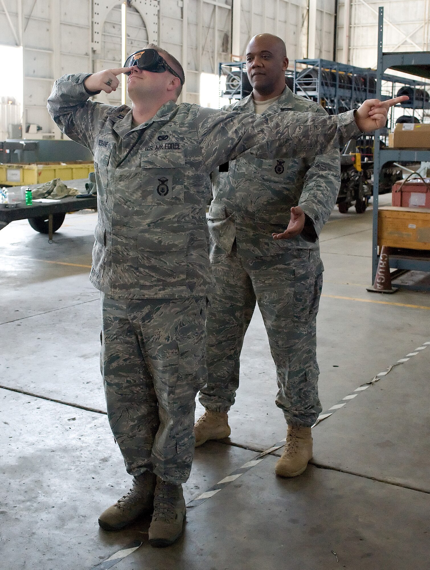 Captain Eric DeShane. 436th Security Forces Squadron, performs a field sobriety test with goggles that impair his vision Feb. 25, 2011, at Dover AFB, Del. (U.S. Air Force photo/Jason Minto)
