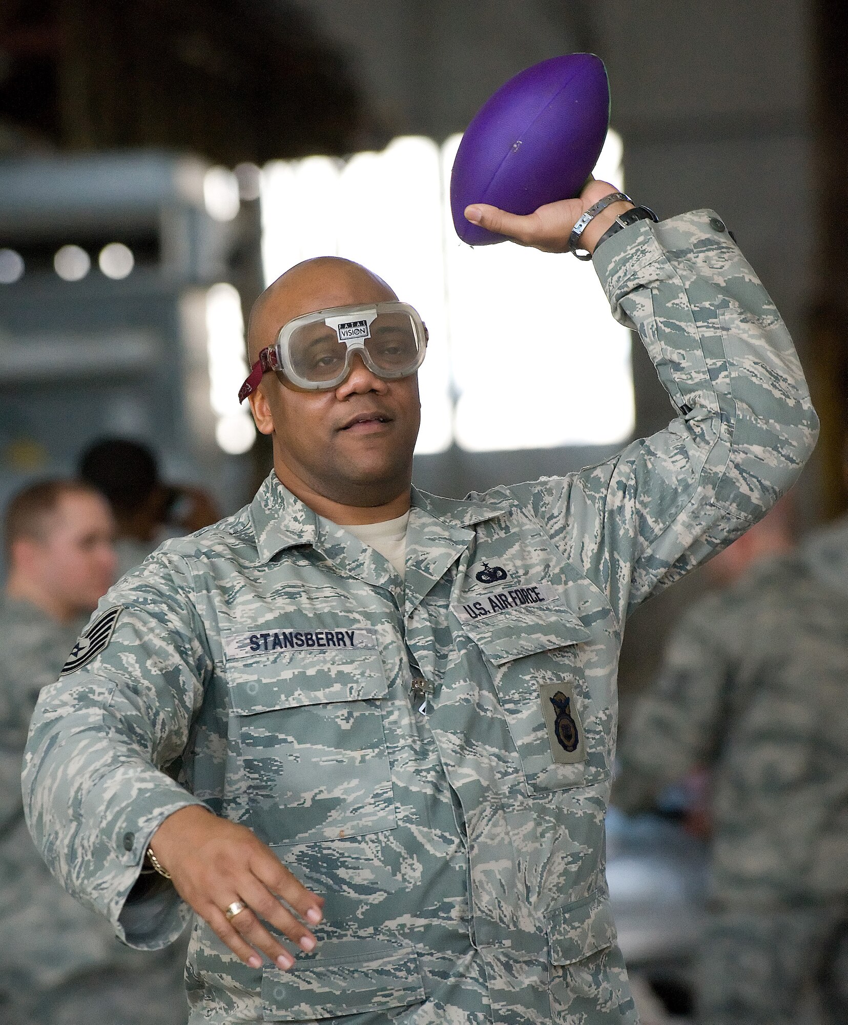 Tech. Sgt. Gary Stansberry, 436th Security Forces Squadron, takes aim in the wrong direction completely as his vision is impaired Feb. 25, 2011, at Dover AFB, Del. (U.S. Air Force photo/Jason Minto