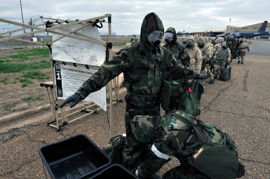 Airmen process through the decontamination zone during the Ability to Survive and Operate Rodeo during the Conventional Operation Readiness Exercise at the Warrior Center on Barksdale Air Force Base, La., Feb. 25. The ATSO Rodeo required Airmen to think on their feet and use skills and training they received prior to the exercise. (U.S. Air Force photo/Airman 1st Class Micaiah Anthony)( RELEASED)