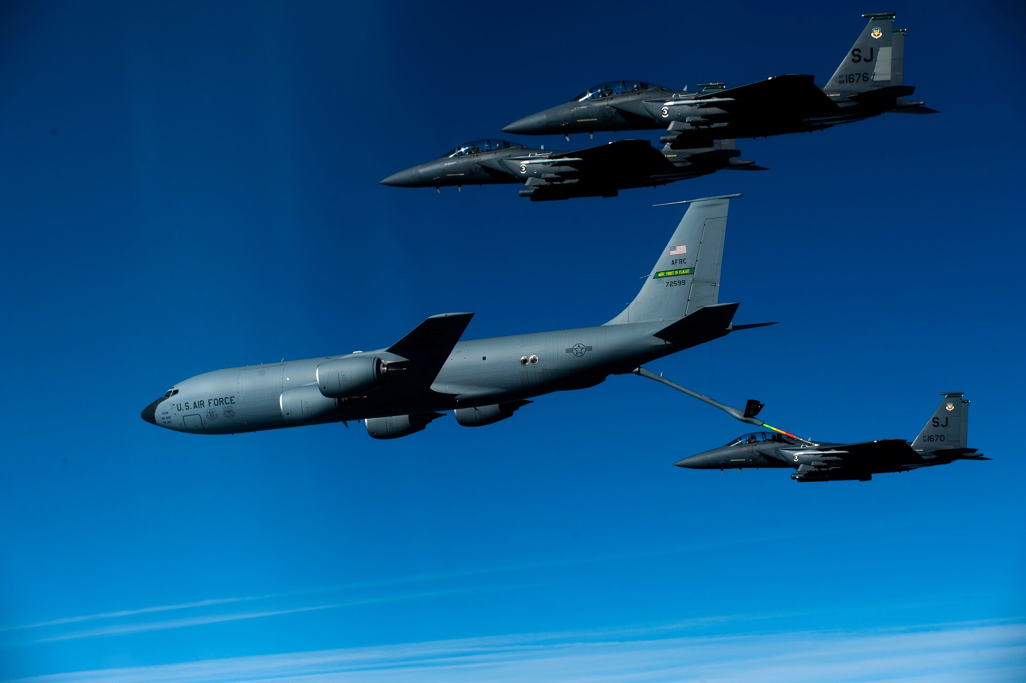 A KC-135R Stratotanker from the 916th Air Refueling Wing refuels an F-15E Strike Eagle in December 2010. Air Force officials recently announced the new contract for the next generation of air-to-air refueling aircraft. (USAF photo by SSgt. Michael Keller, 1CTCS)