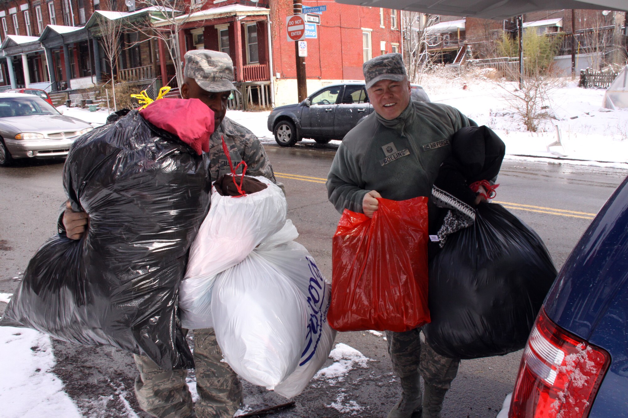 Staff Sgt. Ron McNair (left) and Master Sgt. Patrick Collins, 911th Force Support Squadron, load coats and scarves for delivery to Goodwill of Southwestern Pennsylvania’s Pleasant Valley Emergency Shelter on Pittsburgh’s Northside Feb. 18 as part of the squadron’s Inaugural Coat Drive. Nearly 100 coats and scarves were collected. Whether it is a coat drive for the homeless or donations to Children’s Hospital of Pittsburgh, the 911th FSS plan to make continuing contributions to the surrounding community in the upcoming years.  (U.S. Air Force photo by Staff Sgt. Roberto Modelo)