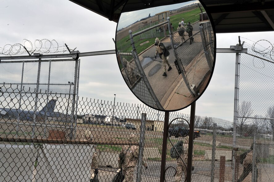 Airmen transit into a decontamination zone during the Ability to Survive and Operate Rodeo during the Conventional Operation Readiness Exercise at the Warrior Center on Barksdale Air Force Base, La., Feb. 25. The ATSO Rodeo required Airmen to think on their feet and use skills and training they received. (U.S. Air Force photo/Airman 1st Class Micaiah Anthony)( RELEASED)