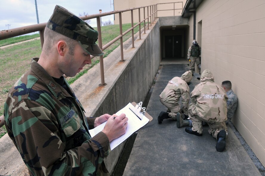 Maj. Jared Cardon, 2nd Dental Squadron, evaluates a group of Airmen during a simulated Post Attack Reconnaissance sweep during the Ability to Survive and Operate Rodeo in the Conventional Operation Readiness Exercise on Barksdale Air Force Base, La., Feb. 25. Unexploded ordnance, traces of chemical or biological threats and wounded Airmen are what teams search for during PAR sweeps. (U.S. Air Force photo/Airman 1st Class Micaiah Anthony)( RELEASED)