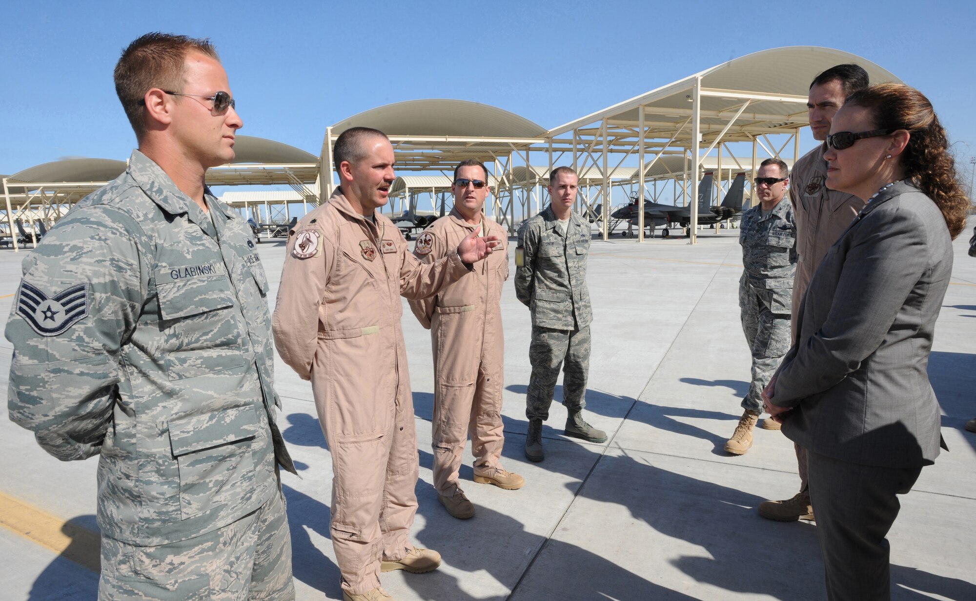 Lt. Col. David Abba, 94th Expeditionary Fighter Squadron, delivers a tour of the flight line to Under Secretary of Defense for Policy Michele Flournoy, Feb. 4, 2011, in Southwest Asia. Mrs. Flournoy met with command staff during her visit here. (U.S. Air Force photo by Senior Airman Maynelinne De La Cruz)