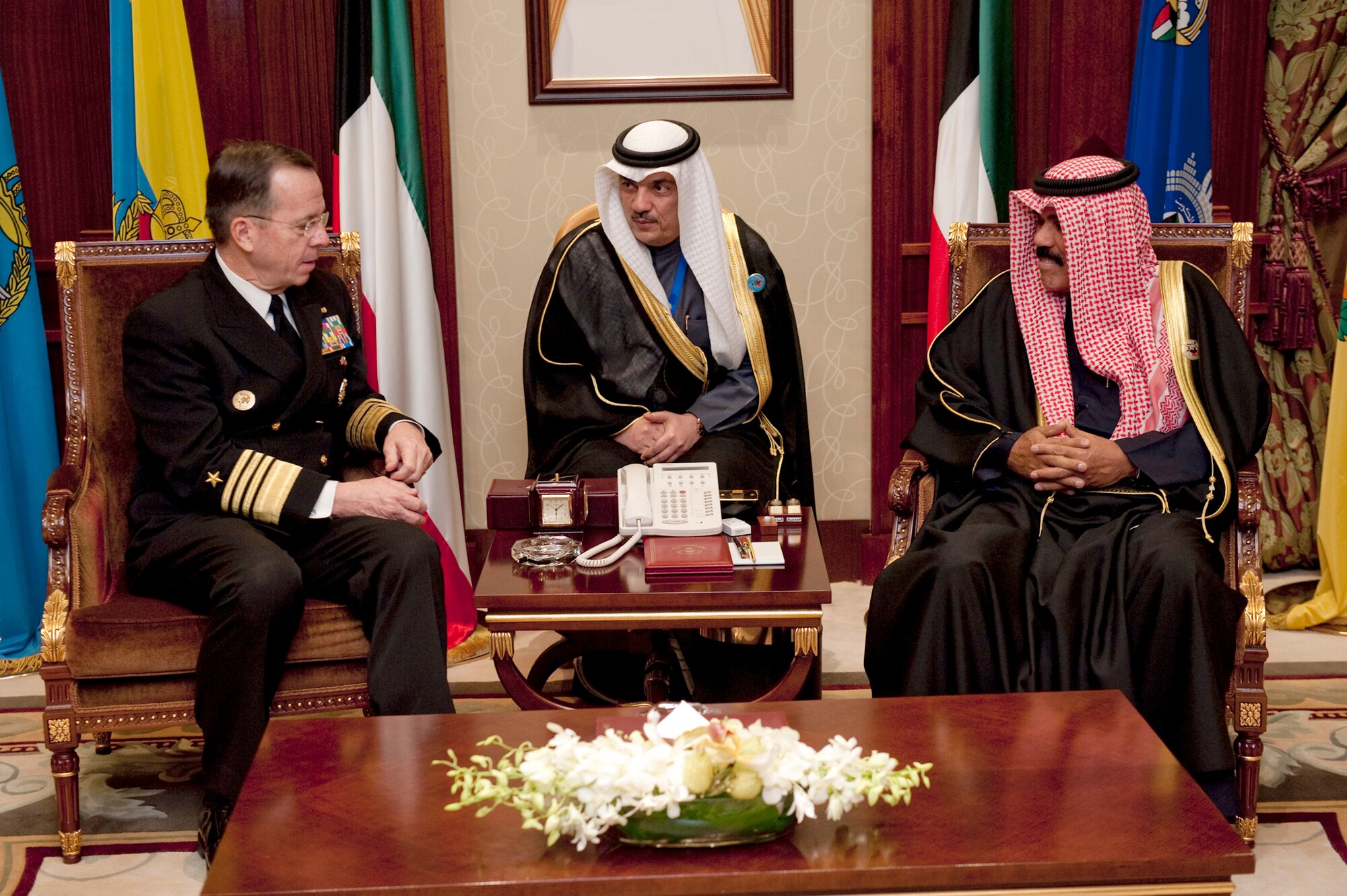 Chairman of the Joint Chiefs of Staff Navy Adm. Mike Mullen meets with Kuwaiti Crown Prince Sheikh Nawaf Al-Ahmad Al-Jaber Al-Sabah as an interpreter assists Feb. 26, 2011, in Kuwait City. (Defense Department photo/Navy Petty Officer 1st Class Chad J. McNeeley)