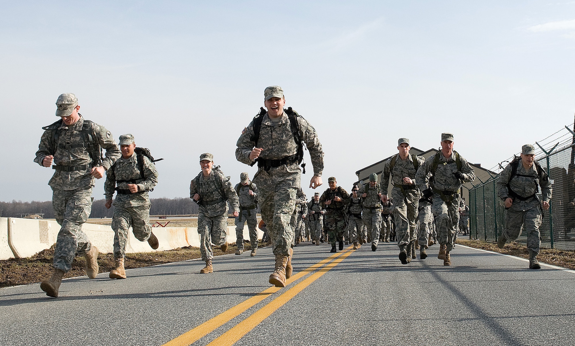 Participants in the 12th Annual Ruck March begin running the course, Feb. 26, 2011, at the Airlift Mobility Command museum, Dover Air Force Base, Del. Runners were required to wear 30-pound rucksacks throughout the 6.2-mile circuit.
