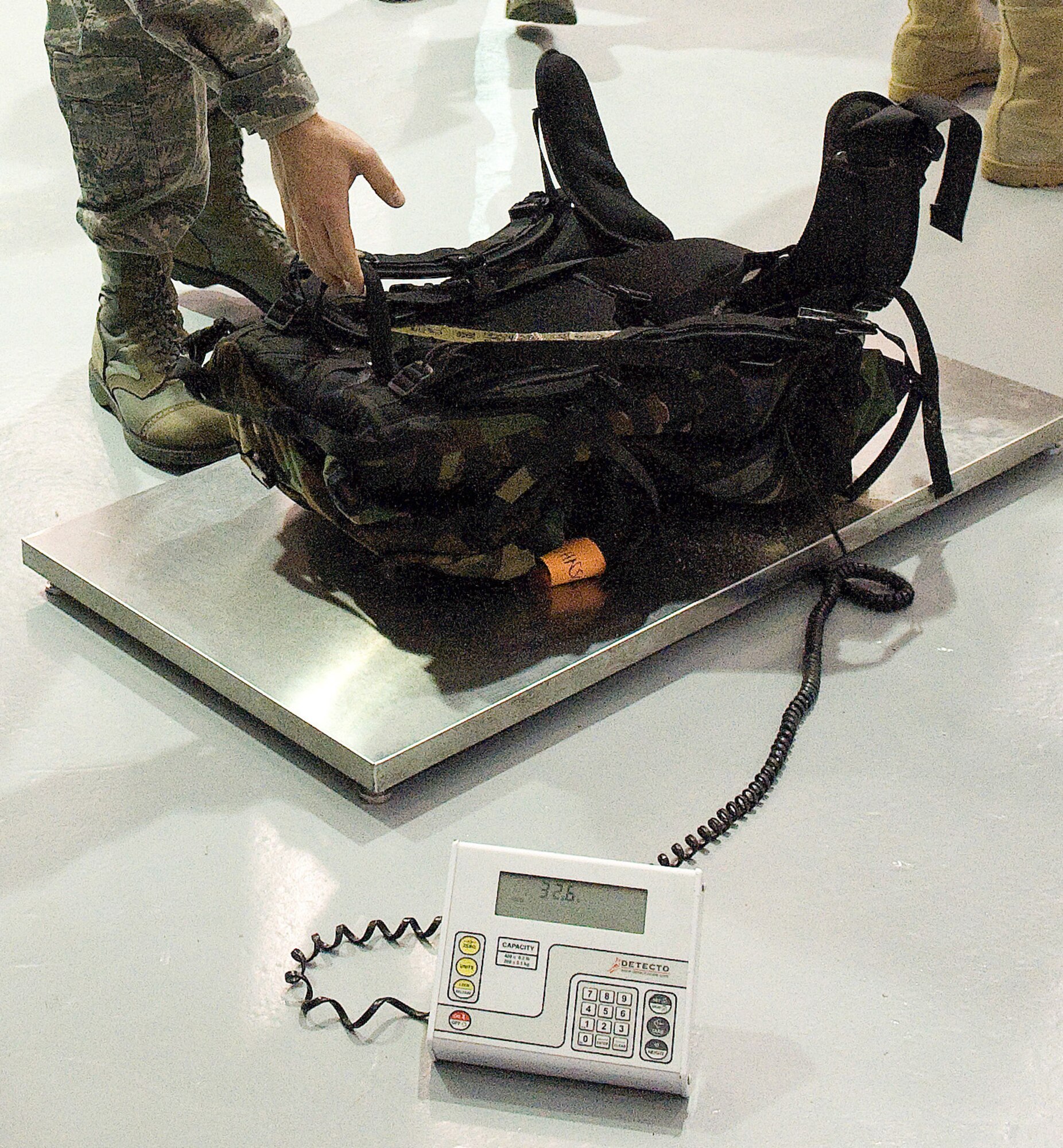 A rucksack is measured, Feb. 26, 2011, before the beginning of the 12th Annual Ruck March at the Airlift Mobility Command museum, Dover Air Force Base, Del. All the rucksacks were required to weigh 30 pounds. 