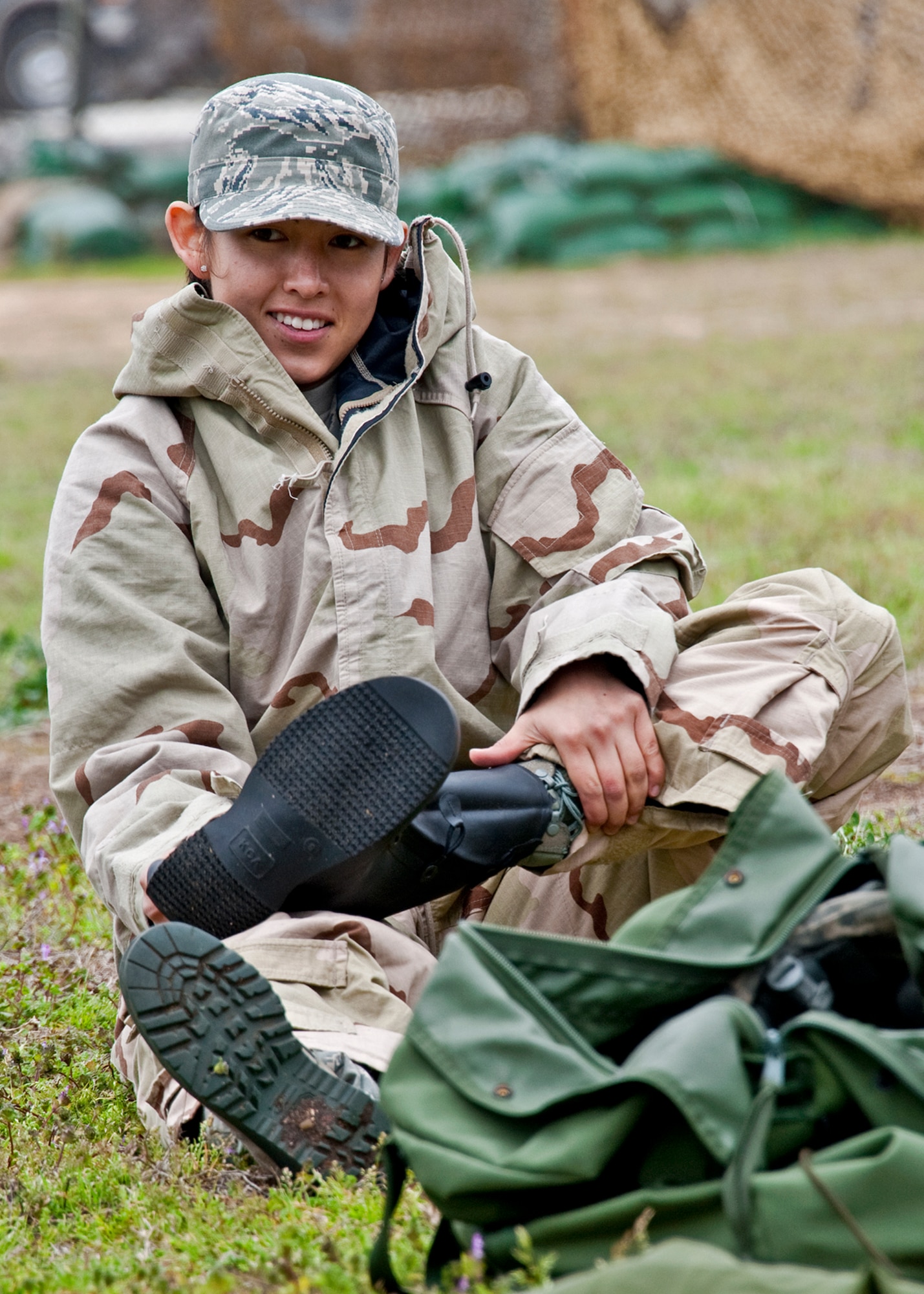 Staff Sgt. Alicia Muro, 46th Operations Support Squadron, pulls on her rubber chemical boots during the Phase II exercise Feb. 24 at Eglin Air Force Base, Fla.  Phase II included self-aid and buddy care, weapons, and chemical, biological, radiological, nuclear and explosive training.  Airmen learned the proper procedures for self-aid and buddy care, field stripping a weapon and also how to wear and work in their chemical gear and gas masks.  Three chalks of Eglin Airmen participated in Phase I and II exercises as part of an Operational Readiness Exercise throughout the week of Feb. 22-25.  (U.S. Air Force photo/Samuel King Jr.)