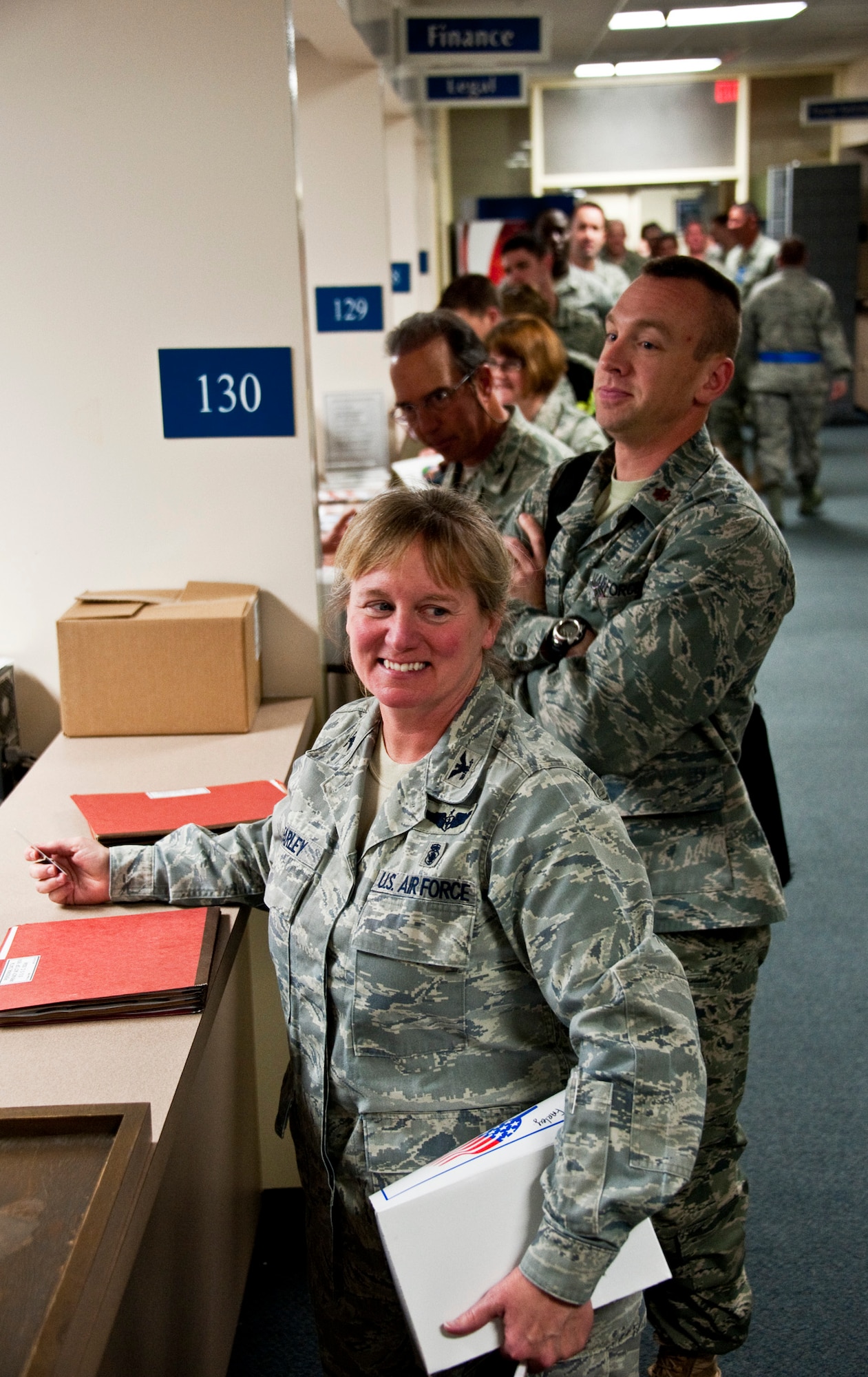 Col. Carole Farley, 96th Inpatient Squadron, leads the first chalk through the deployment line as part of the Phase I exercise Feb. 23 at Eglin Air Force Base, Fla.  Phase I included deployment preparation, records review, mobility gear and weapon issue.  Three chalks of Eglin Airmen participated in Phase I and II exercises as part of an Operational Readiness Exercise throughout the week of Feb. 22-25.  (U.S. Air Force photo/Samuel King Jr.) 