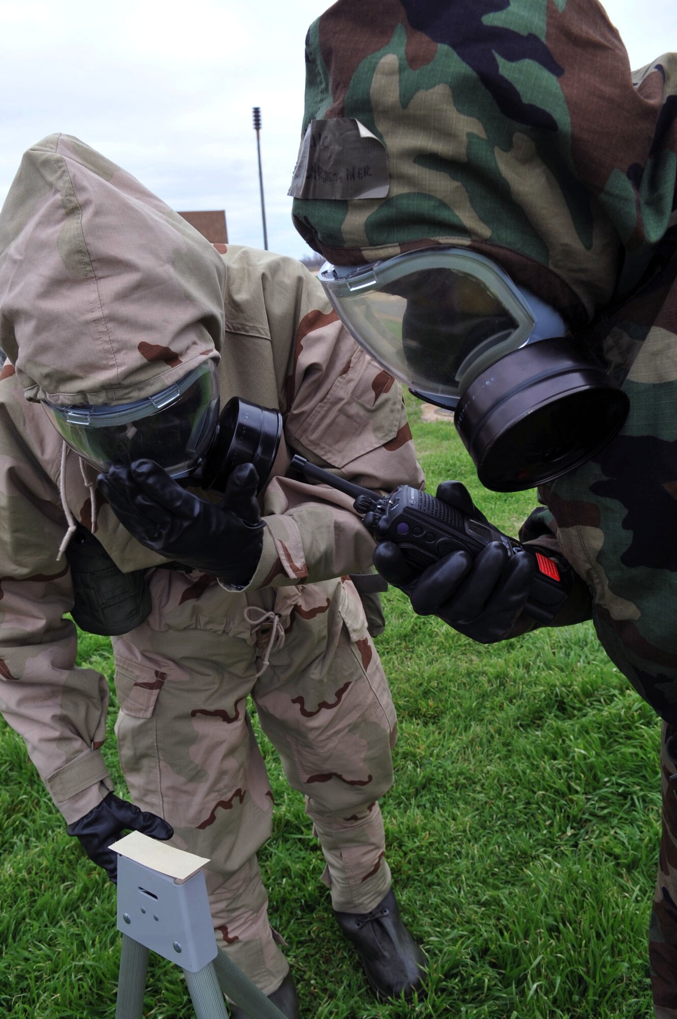 Airmen read a M8 chemical agent detection strip to identify chemical agents during the Ability to Survive and Operate Rodeo as part of a Conventional Operational Readiness Exercise at Barksdale Air Force Base, La., Feb. 25. ATSO Rodeo tested the knowledge and skill of Airmen to respond to chemical attacks.  (U.S. Air Force photo/Senior Airman Brittany Y. Bateman)(RELEASED)