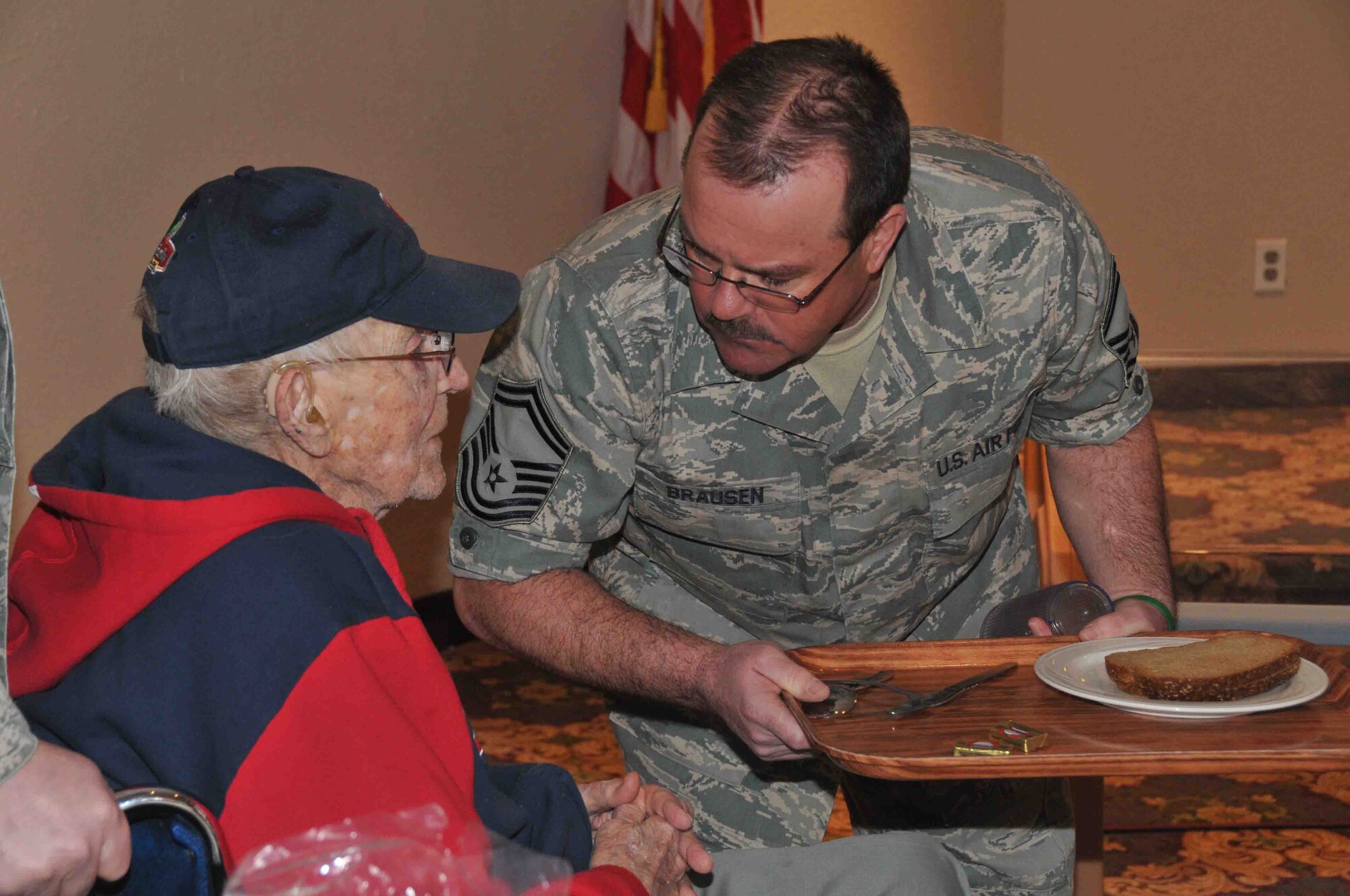 934th Airlift Wing members share lunch and memories during "Take a Vet to Lunch Day" at the 934th Airlift Wing Services Club Feb. 24. (Photo by Paul Zadach)