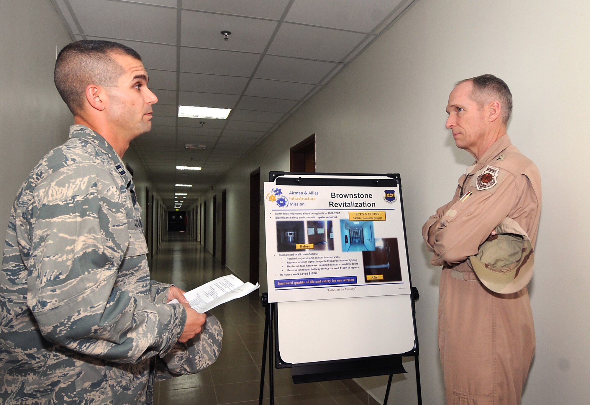 Lieutenant General Mike Hostage, U.S. Air Forces Central Command commander, visits with Capt. Jason Adams, 386th Civil Engineer chief of operations, about the new dormitory renovations Feb. 25. General Hostage toured the base to talk with 386th Air Expeditionary Wing Airmen and to view base improvements and capabilities. (U.S. Air Force photo by Senior Airman Cynthia Spalding)