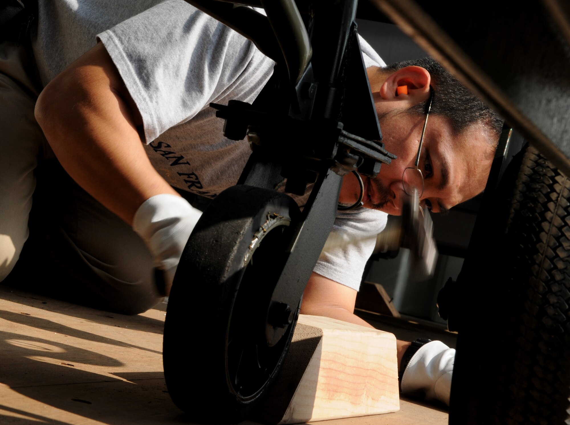 Eiji Inoha, a forklift operator foreman with the 18th Logistics Readiness Squadron, secures a self generating nitrogren cart into a shipment cargo in preparation for Balikatan at Kadena Air Base Feb. 24. Balikatan is an annual joint bilateral exercise between the U.S. military and the Philippine military designed to improve combined planning, combat readiness and interoperability for a wide range of operations. (U.S. Air Force photo/Airman 1st Class Jarvie Z. Wallace)