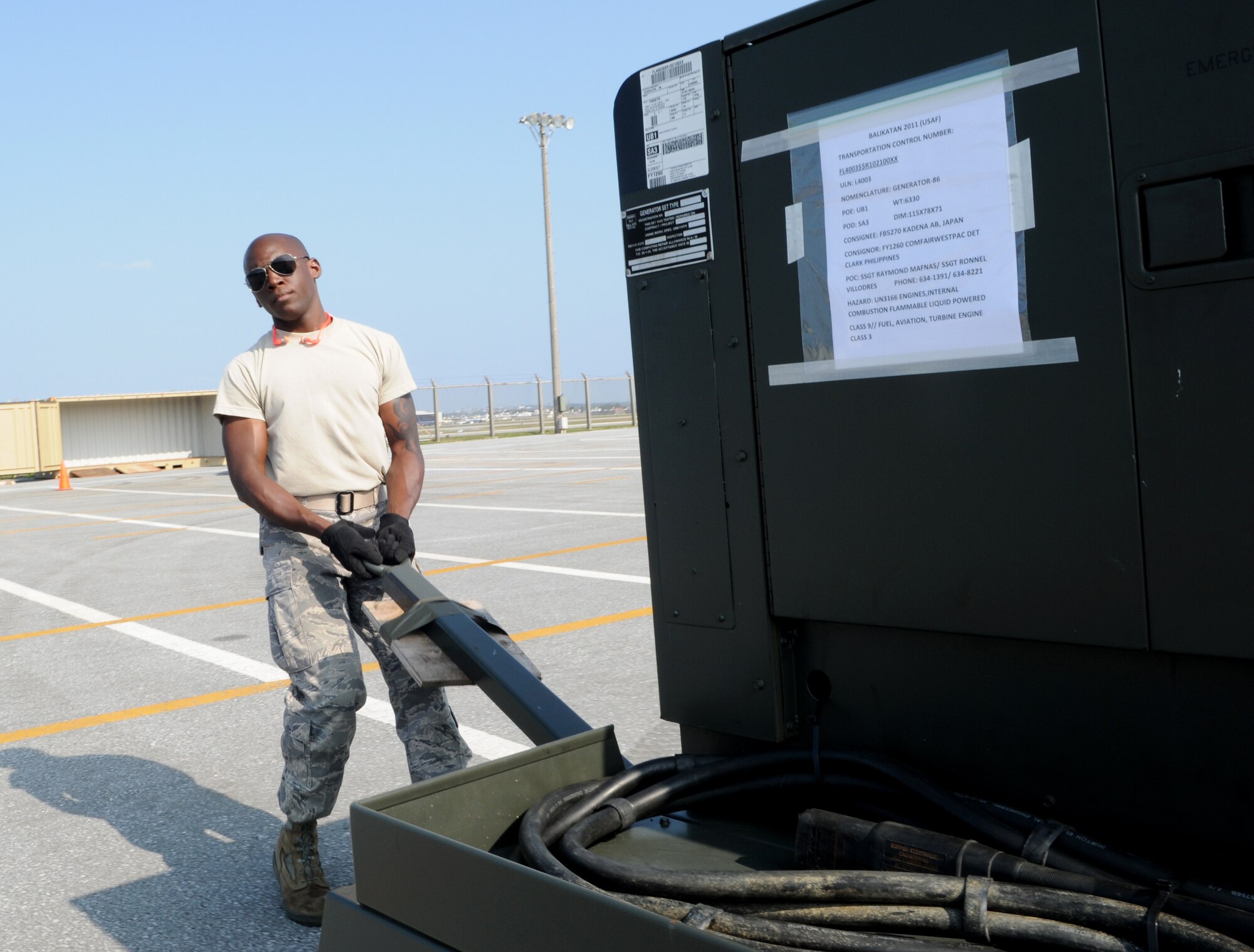 Airman 1st Class Jordan Day, a vehicle mechanic with the 18th Logistics Readiness Squadron, moves a self generating nitrogren cart into a shipment cargo in preparation for Balikatan at Kadena Air Base Feb. 24. Balikatan is an annual joint bilateral exercise between the U.S. military and the Philippine military designed to improve combined planning, combat readiness and interoperability for a wide range of operations. (U.S. Air Force photo/Airman 1st Class Jarvie Z. Wallace)