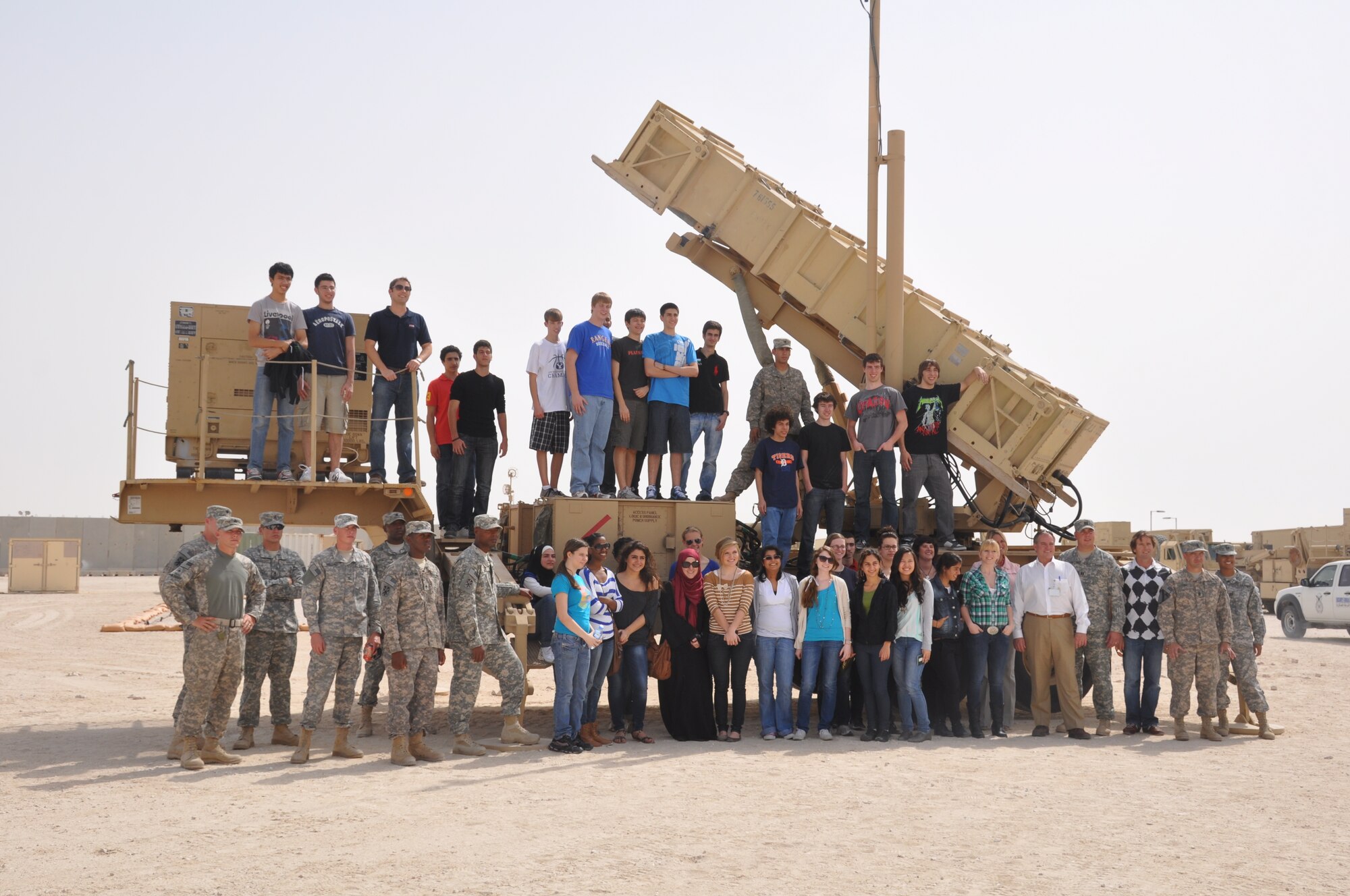 U.S. Army Soldiers gathered on an Army Patriot Launch Station with students and staff from the American school downtown during a tour of the base Feb. 24.  (U.S. Air Force photo/Senior Airman Veronica McMahon)