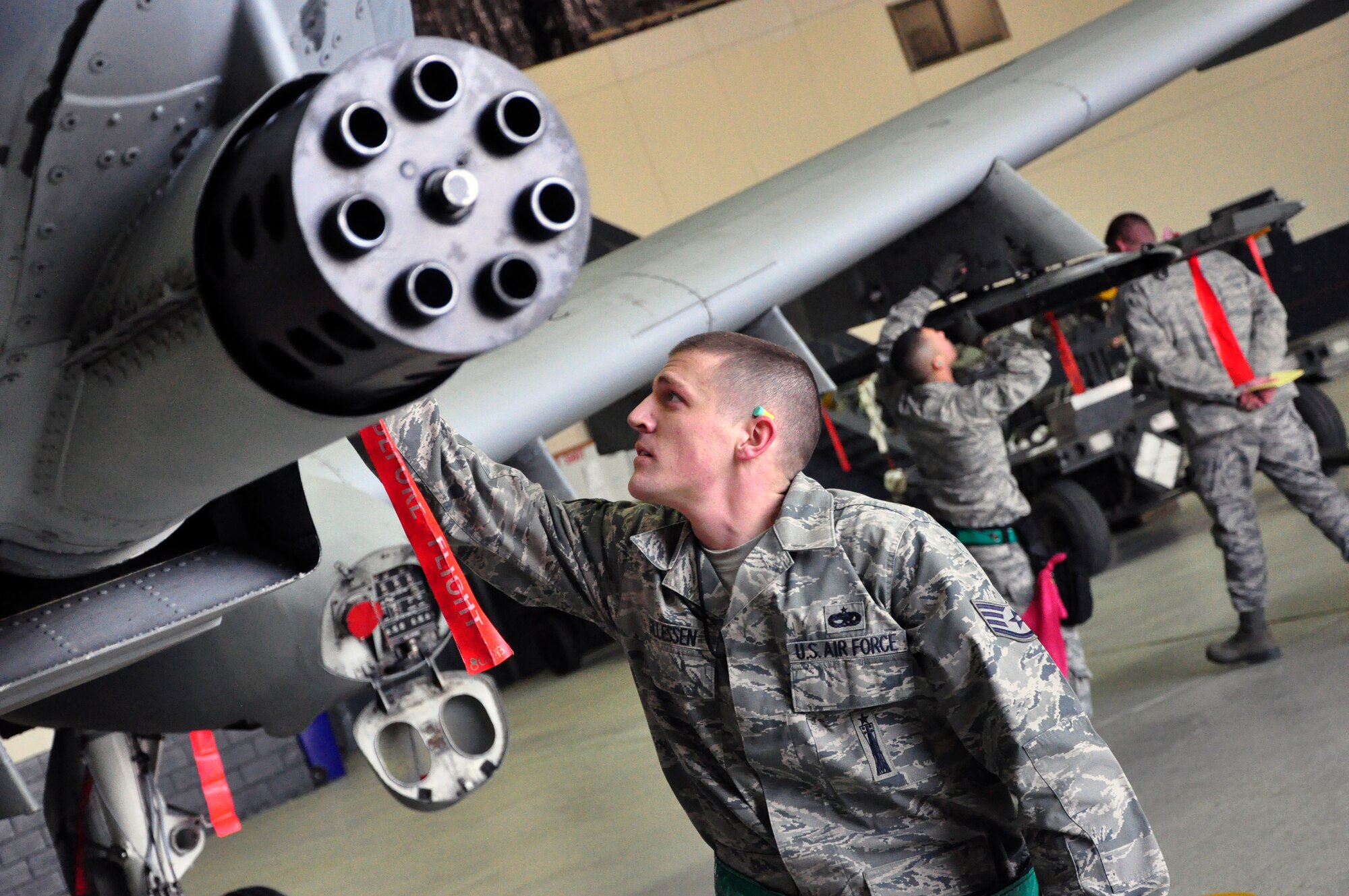 Staff Sgt. Charles Gillessen, 51st Aircraft Maintenance Squadron, performs a pre-flight check of an A-10 Thunderbolt II during a weapons loading competition for the best load crew of the year in a hangar at Osan Air Base, Republic of Korea, Feb. 25 (U.S. Air Force photo/Staff Sgt. Chad Thompson).