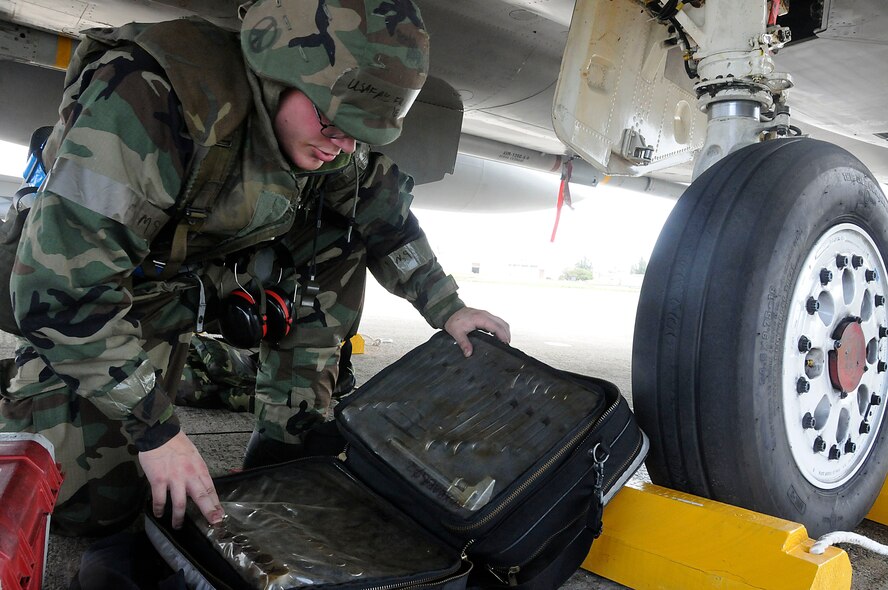 Airman 1st Class Frank Jenkins, 44th Aircraft Maintenance Unit crew chief, performs a tool accountability after completing his post flight inspection of an F-15 Eagle during the Beverly High 11-03 exercise at Kadena Air Base, Feb 28. The tool accountability ensures that he leaves with every tool and doesn't create potential foreign object damage on the flight line. (U.S. Air Force photo/Staff Sgt. Darnell T. Cannady)