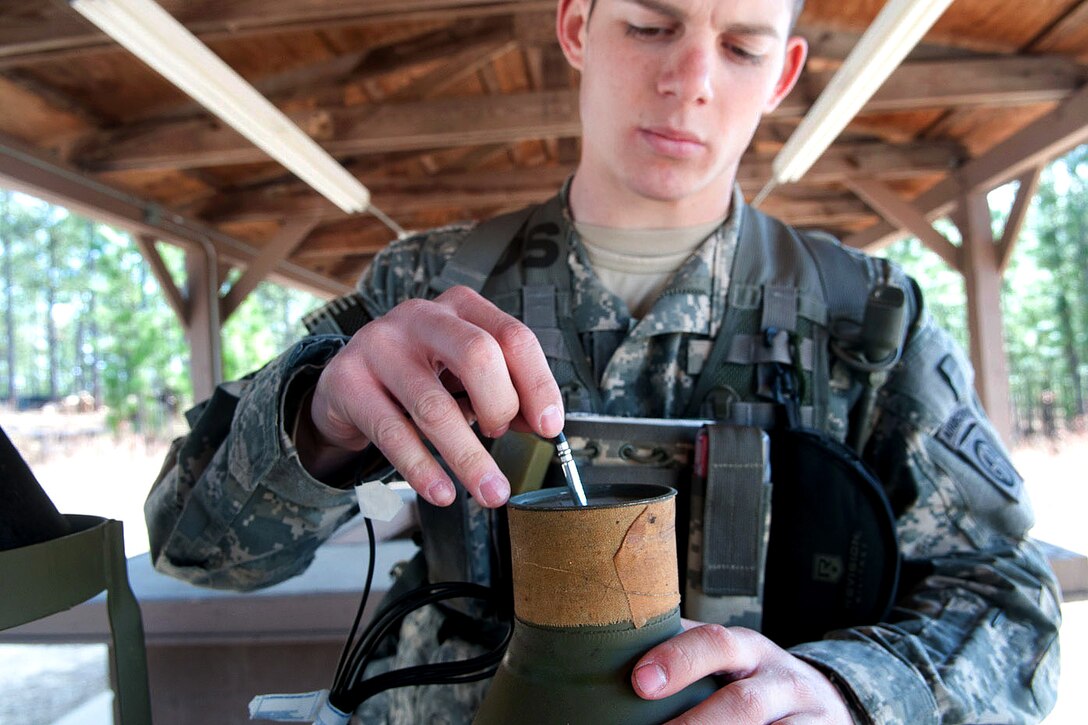 Army Pfc. Kevin Bernstein prepares a 40-pound explosive for detonation, on Fort Bragg, N.C., Feb. 23, 2011. Bernstein is a combat engineer assigned to the 82nd Airborne Division’s 1st Brigade Combat Team.