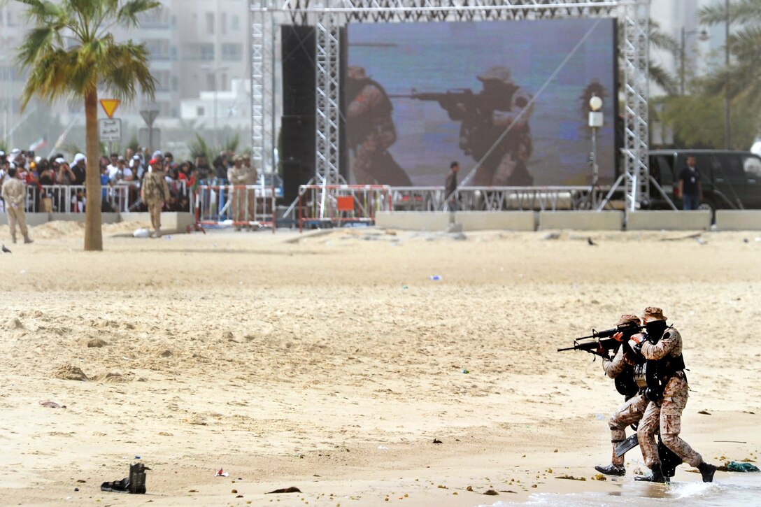 Kuwaiti marines demonstrate a beach assault at the Marina Mall in Kuwait City, Feb. 28, 2011.