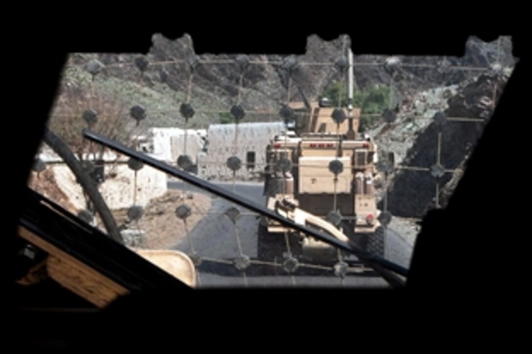 U.S. Army soldiers convoy their vehicles in Nangarhar province, Afghanistan, Feb. 25, 2011. The soldiers are assigned to Company G, 2nd Battalion, 320th Field Artillery Regiment, Task Force Balls.