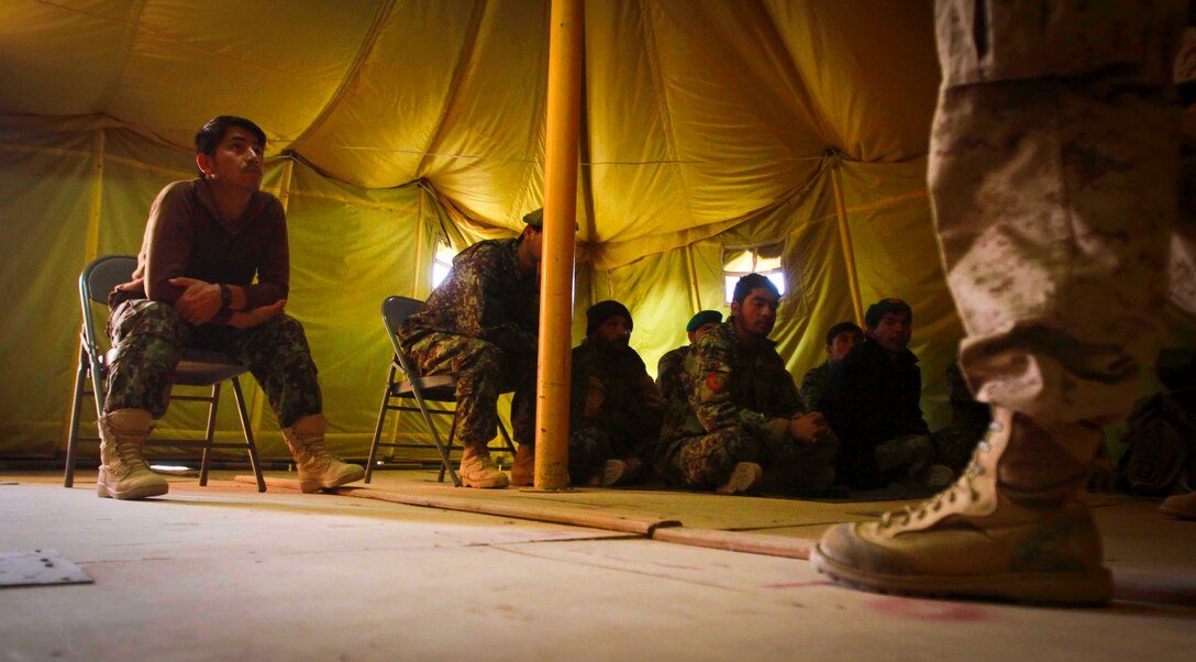 Afghan national army soldiers attend a medical class taught by sailors with Combat Logistics Battalion 3's Embedded Partnering Team aboard Camp Garm-sher, Afghanistan, Jan. 1. The Marines and sailors of CLB-3's EPT are currently mentoring ANA soldiers to operate independent from coalition forces.