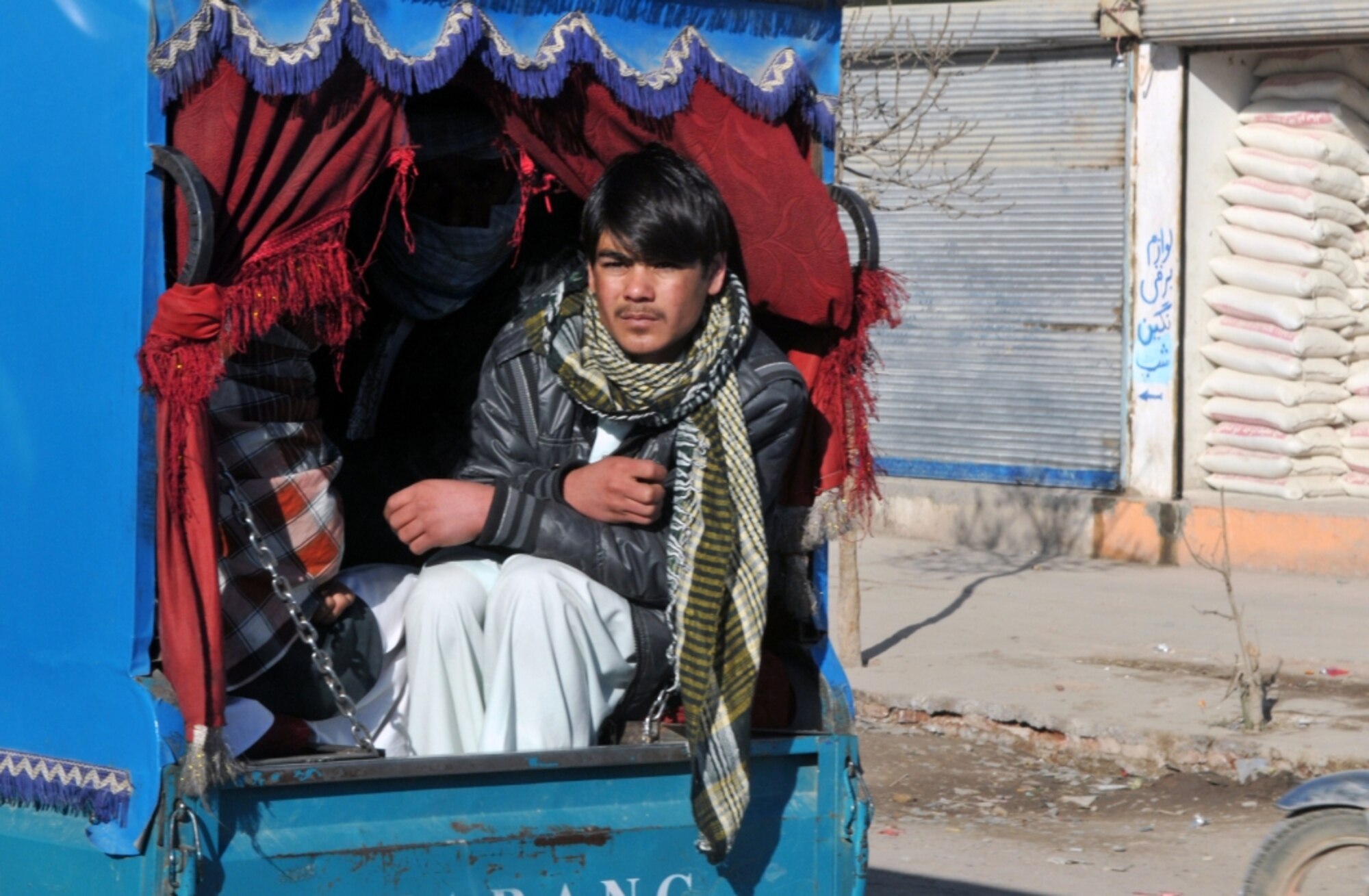 An Afghan man rides down a Herat City street Dec. 31, 2010. Herat City is increasingly becoming a benchmark for progress in Afghanistan. (U.S. Air Force photo/Tech. Sgt. Kevin Wallace)