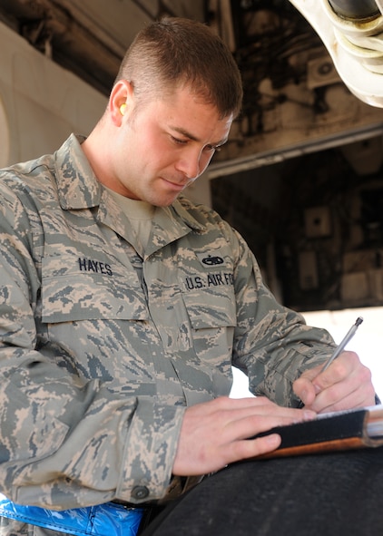 DYESS AIR FORCE BASE, Texas --Staff Sgt. Matthew Hayes, 7th Aircraft Maintenance Squadron, notes all work completed on the aircraft here, Dec. 29. Sergeant Hayes is an electronic warfare technician who is responsible for operating and maintaining avionics systems. He fixes malfunctions in avionics systems, radar, integrated test systems built-in-test, recording systems, video display systems and various other systems. (U.S. Air Force photo/Senior Airman Jenifer H. Calhoun)
