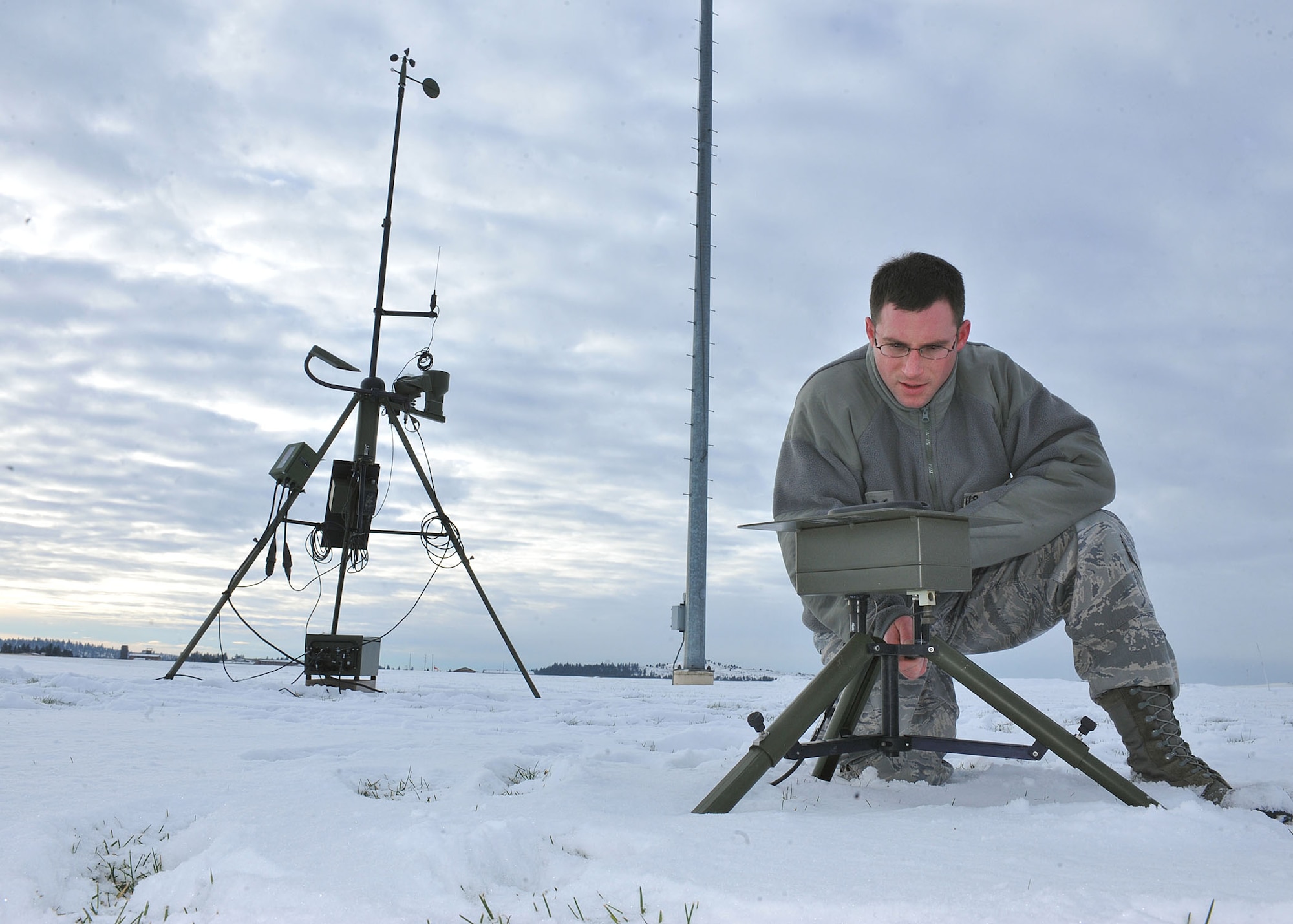Senior Airman Craig Madara, 92nd Operations Support Squadron weather journeyman, checks a Tactical Meteorology Observing System Dec. 21, 2010 here. The purpose of the system is to observe weather conditions. Airman Madara is also performing operational checks to ensure the system is ready for inclement weather. (U.S. Air Force Photo/Tech. Sgt. JT May III)